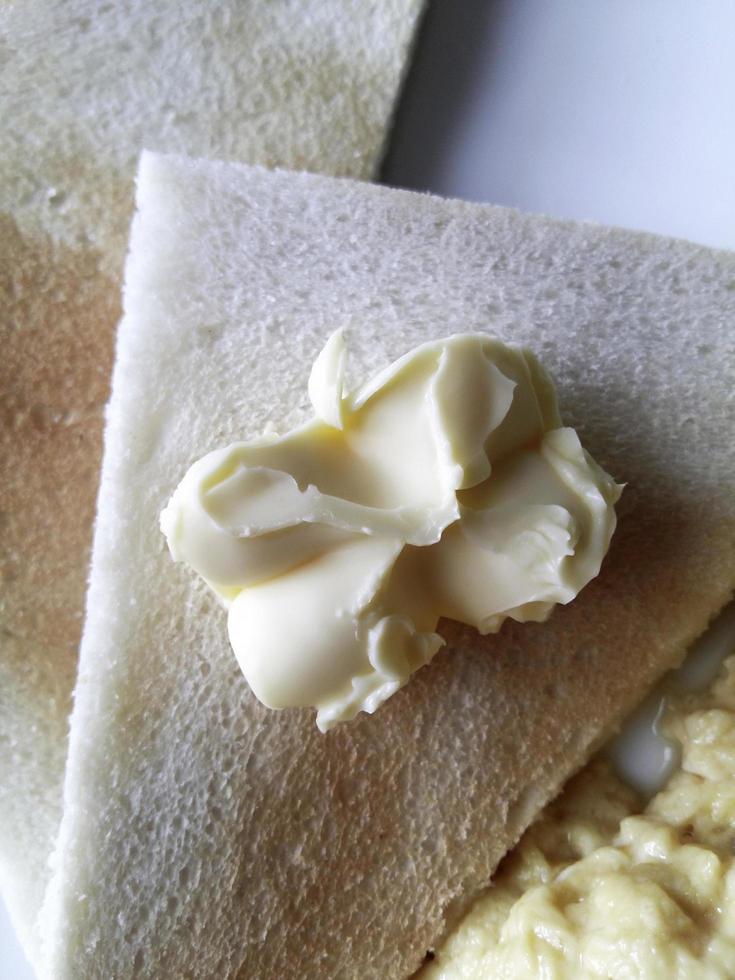 Butter on crepe photo