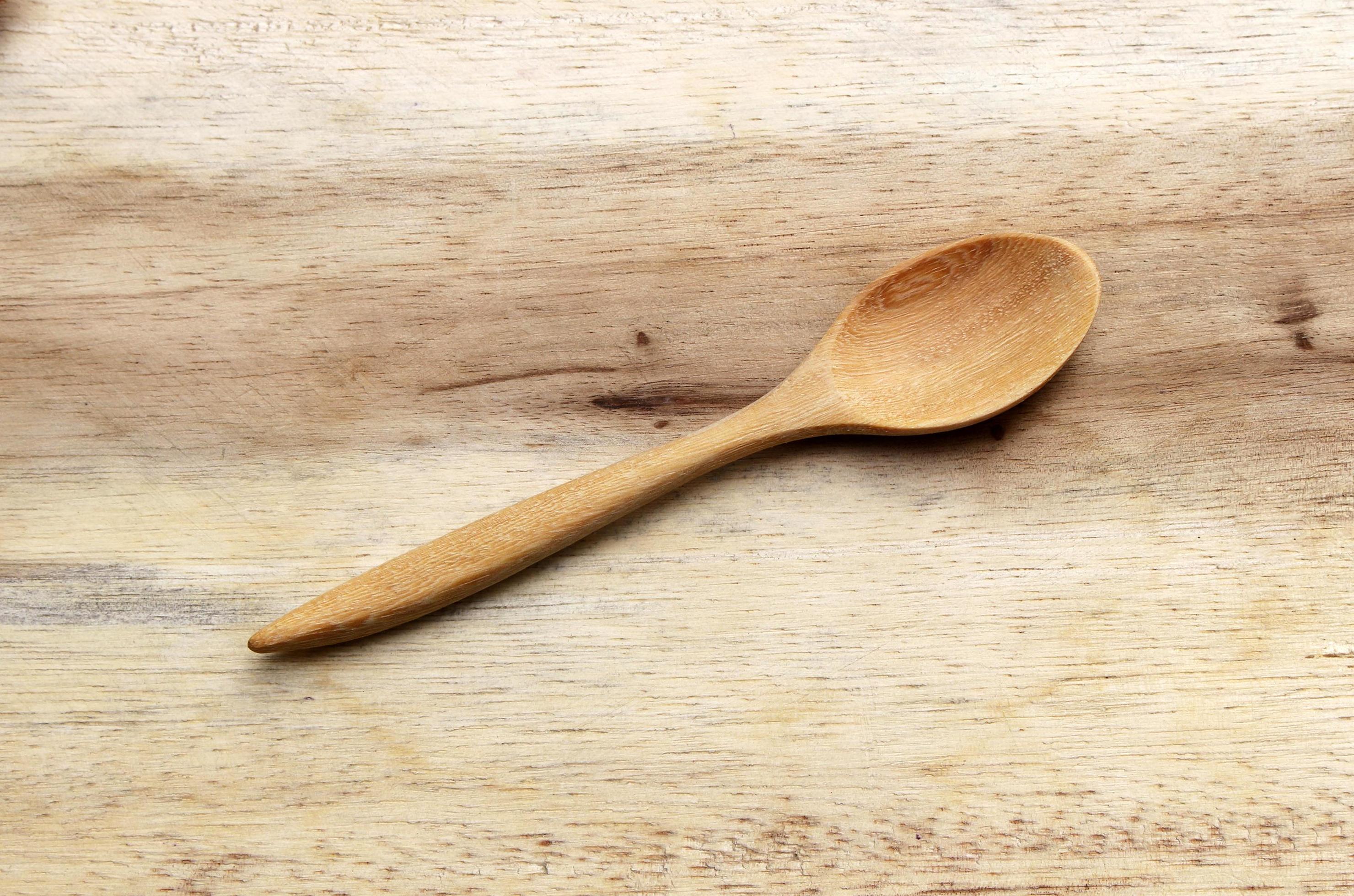 Wooden spoon on wooden background 1926994 Stock Photo at Vecteezy