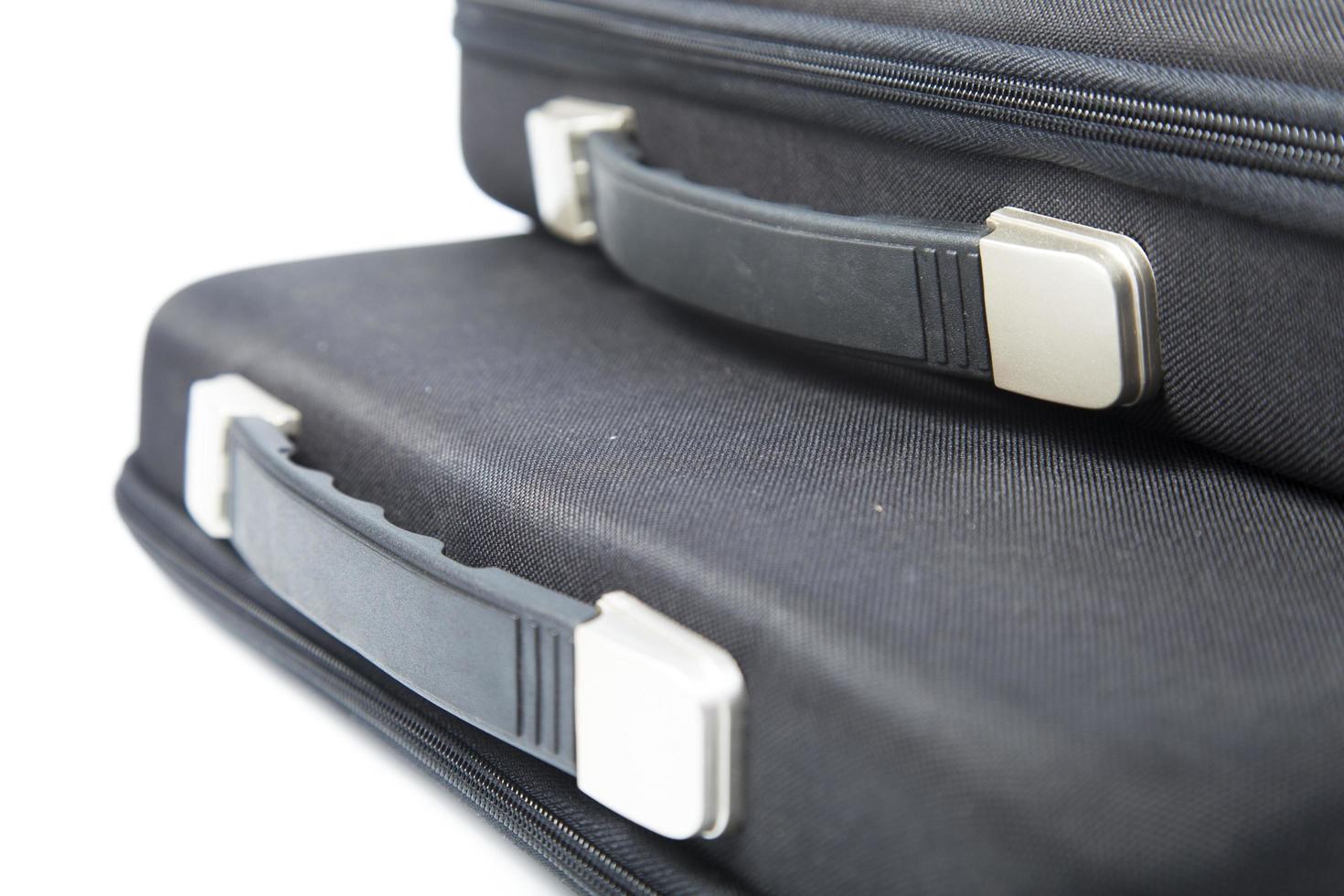 Black briefcases on white background photo