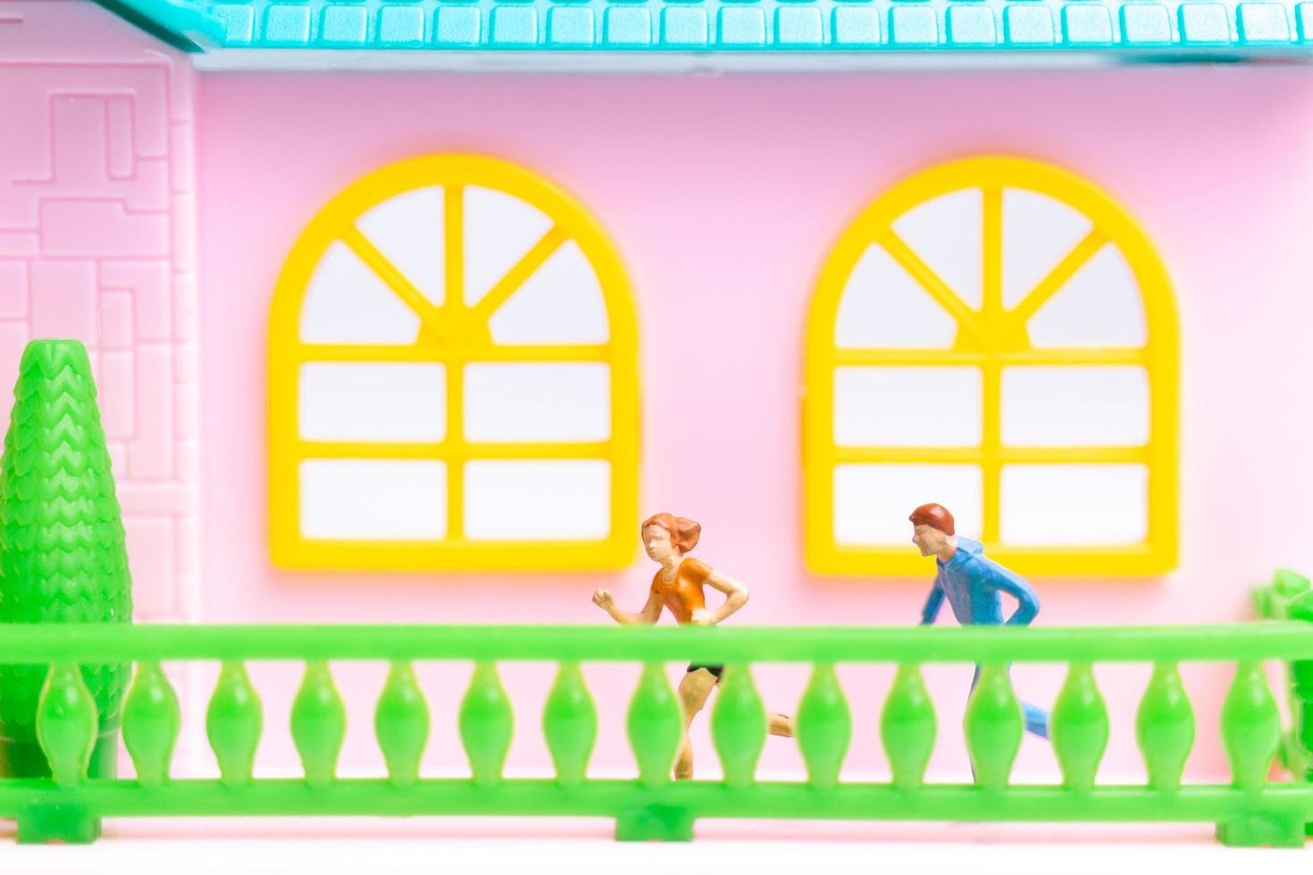 Two figurines running photo