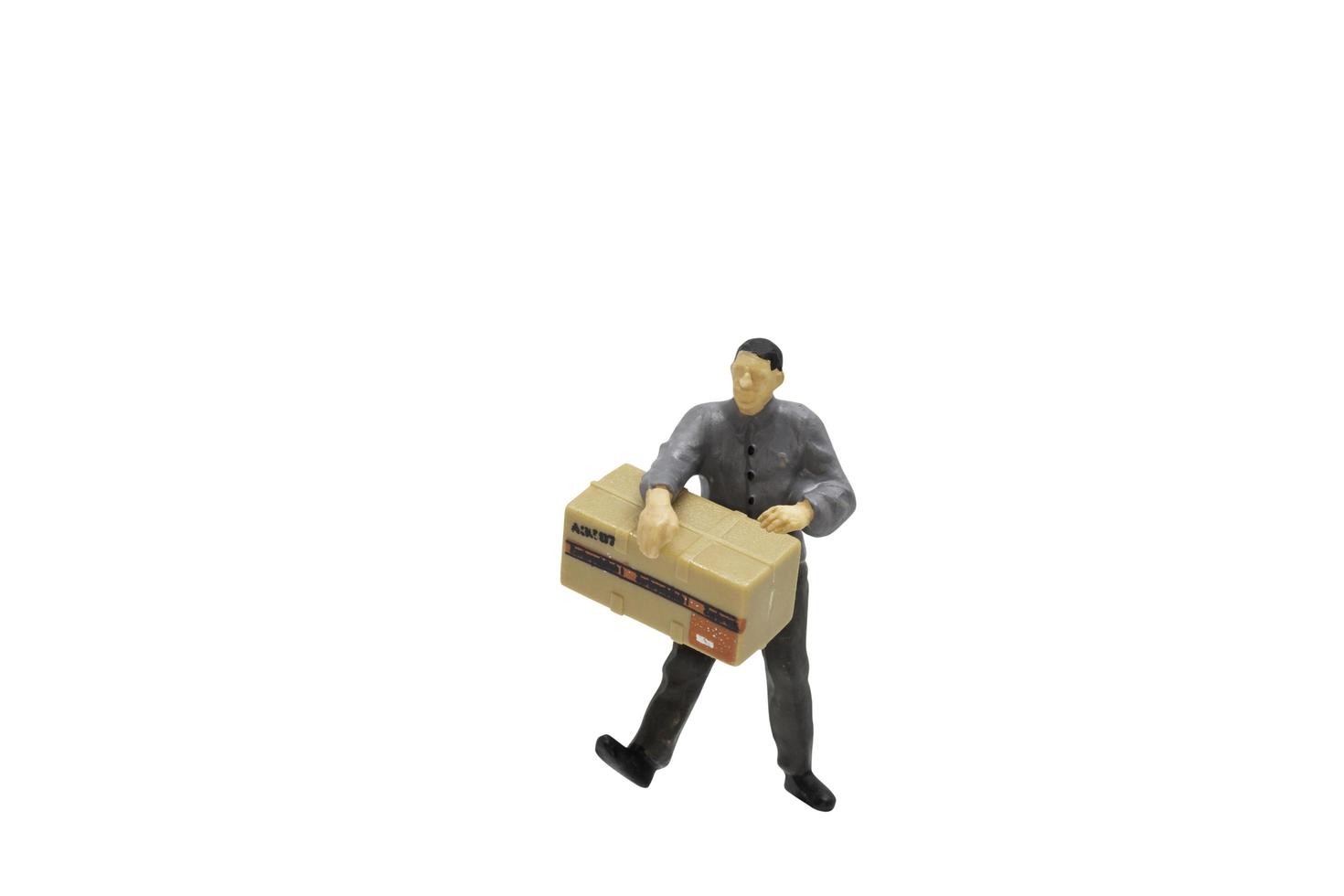 Miniature figurine of a delivery man photo