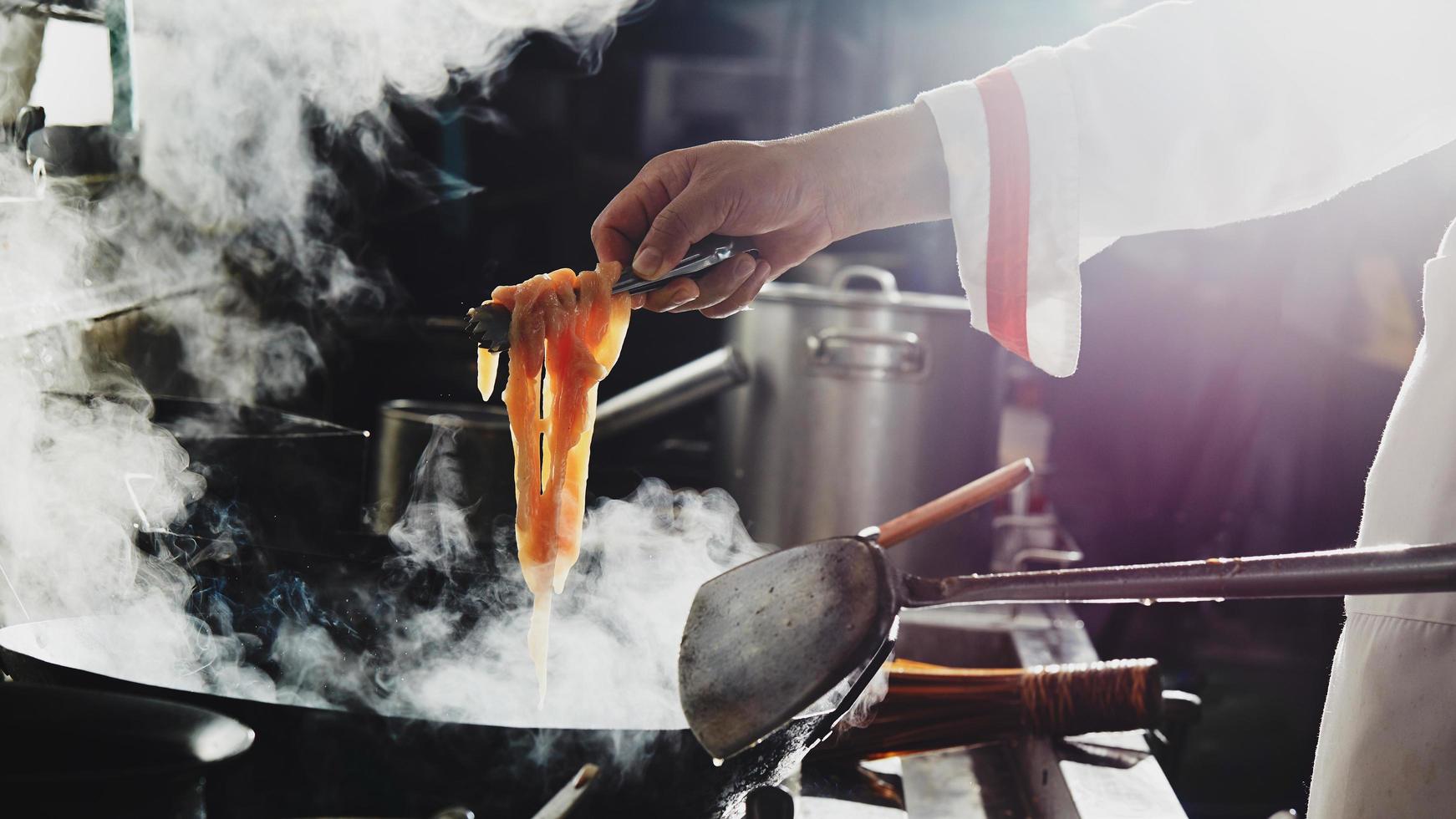 Chef cooking noodles photo
