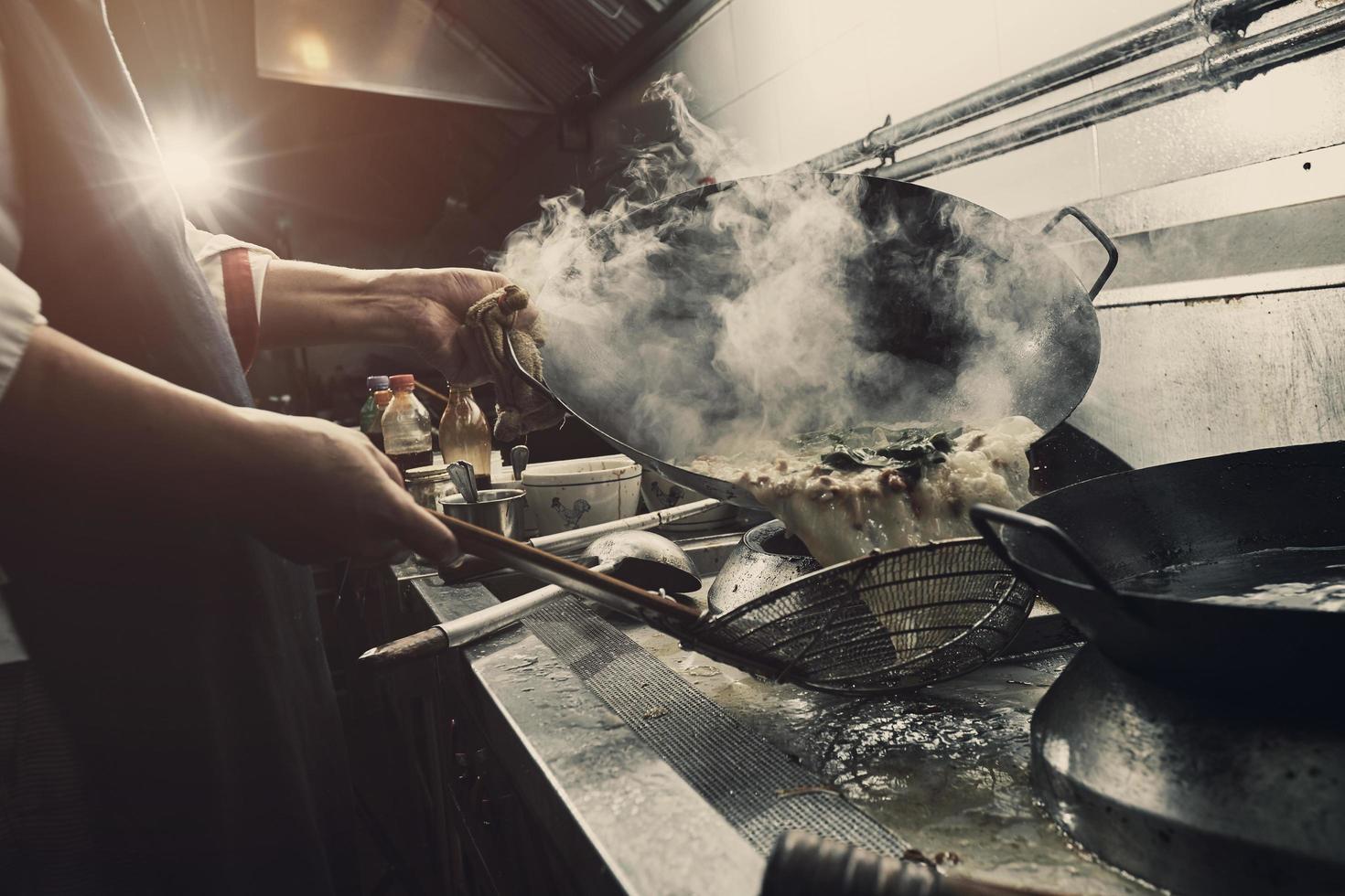 Chef cooking on stove photo