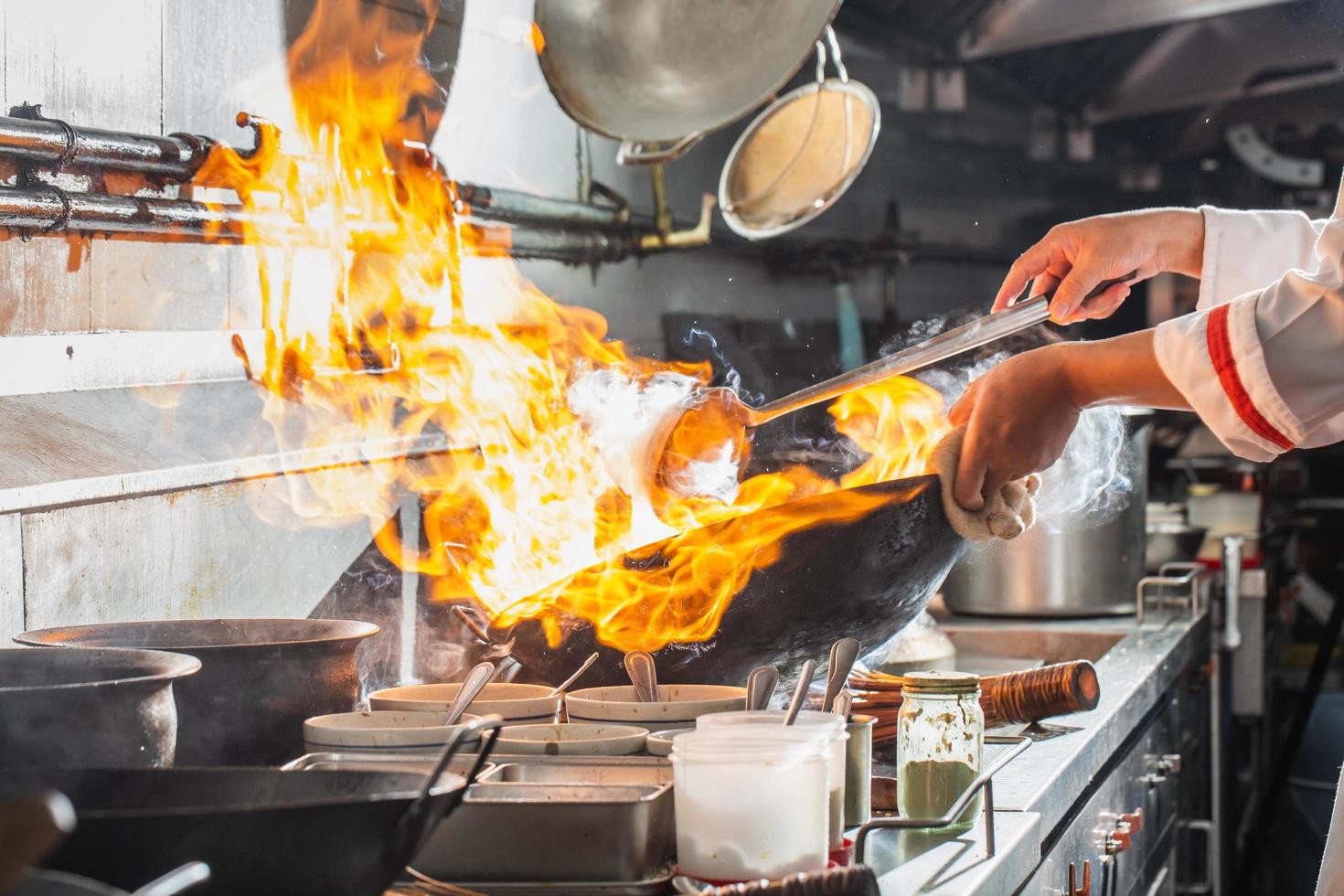 Chef cooking on a stove photo