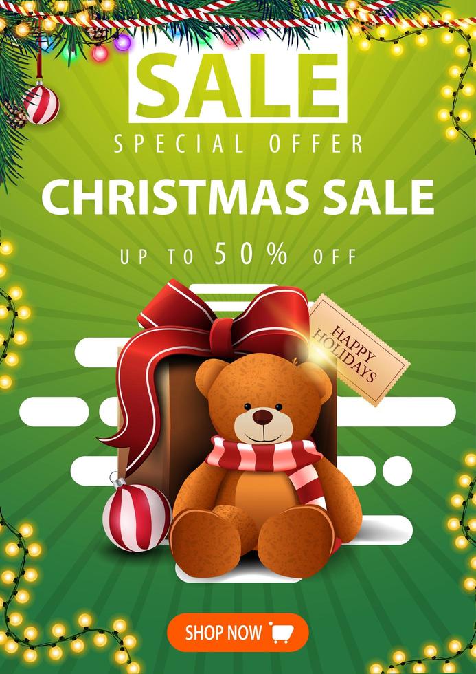 oferta especial, rebajas navideñas, hasta 50 de descuento, banner vertical verde con ramas navideñas, guirnaldas, botón y regalo con osito vector