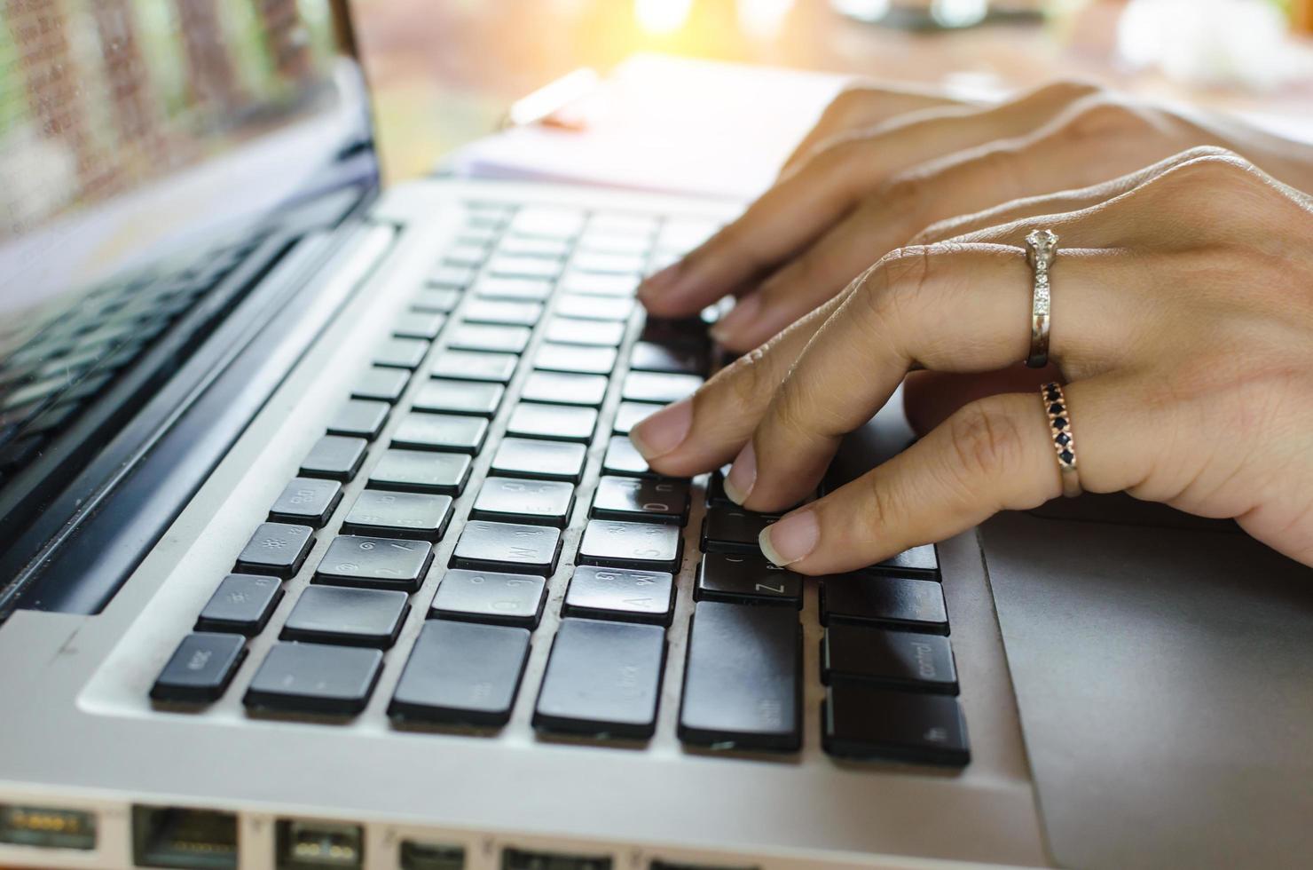 Woman typing on a keyboard photo