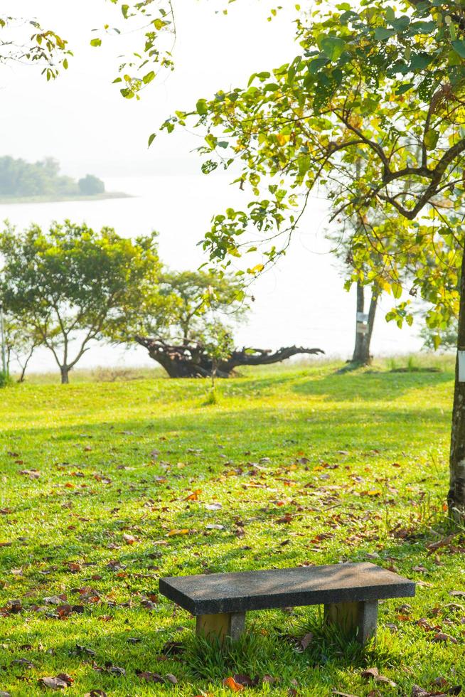 Stone bench on the lawn photo