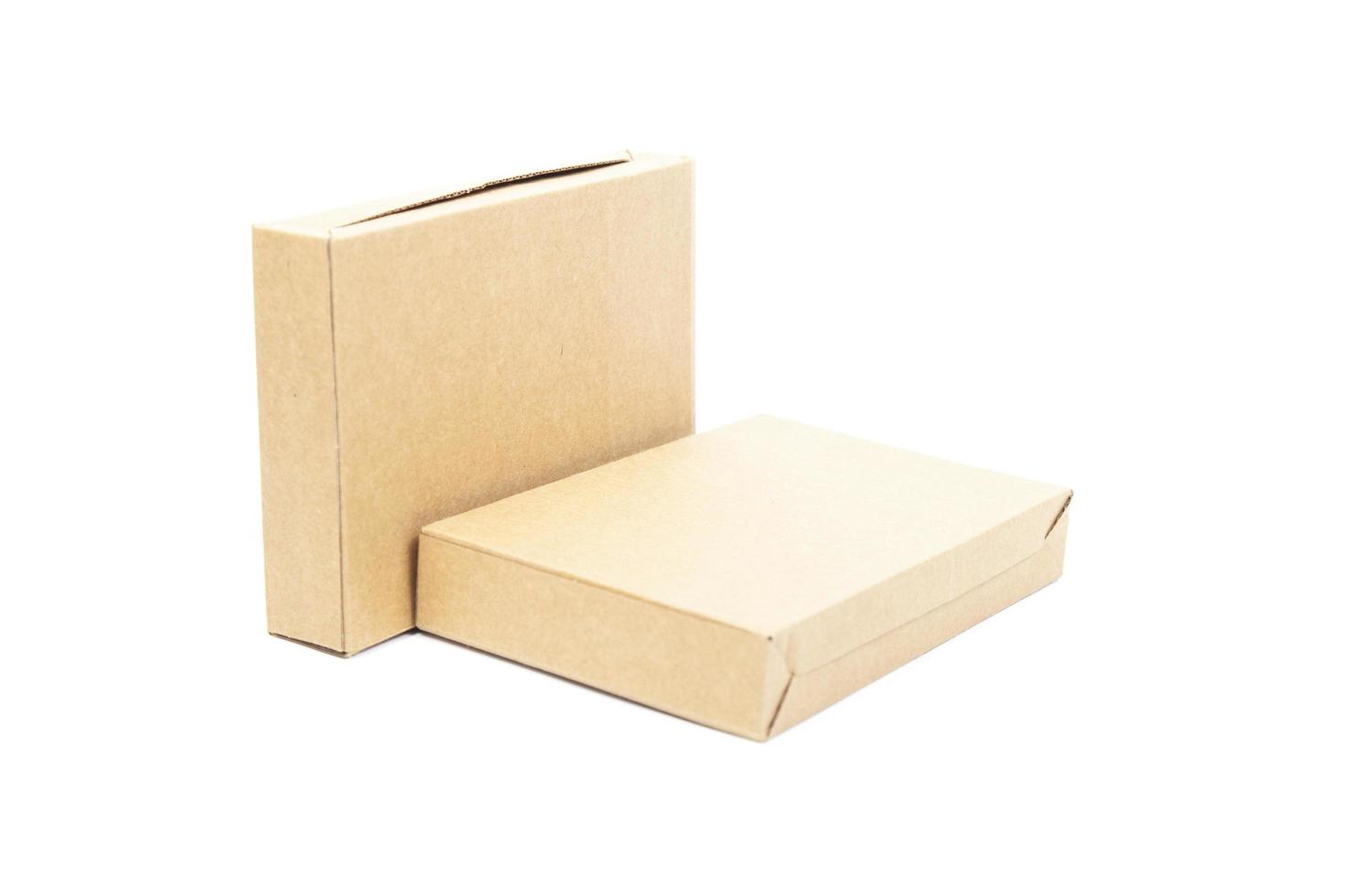 Two brown paper boxes on white background photo