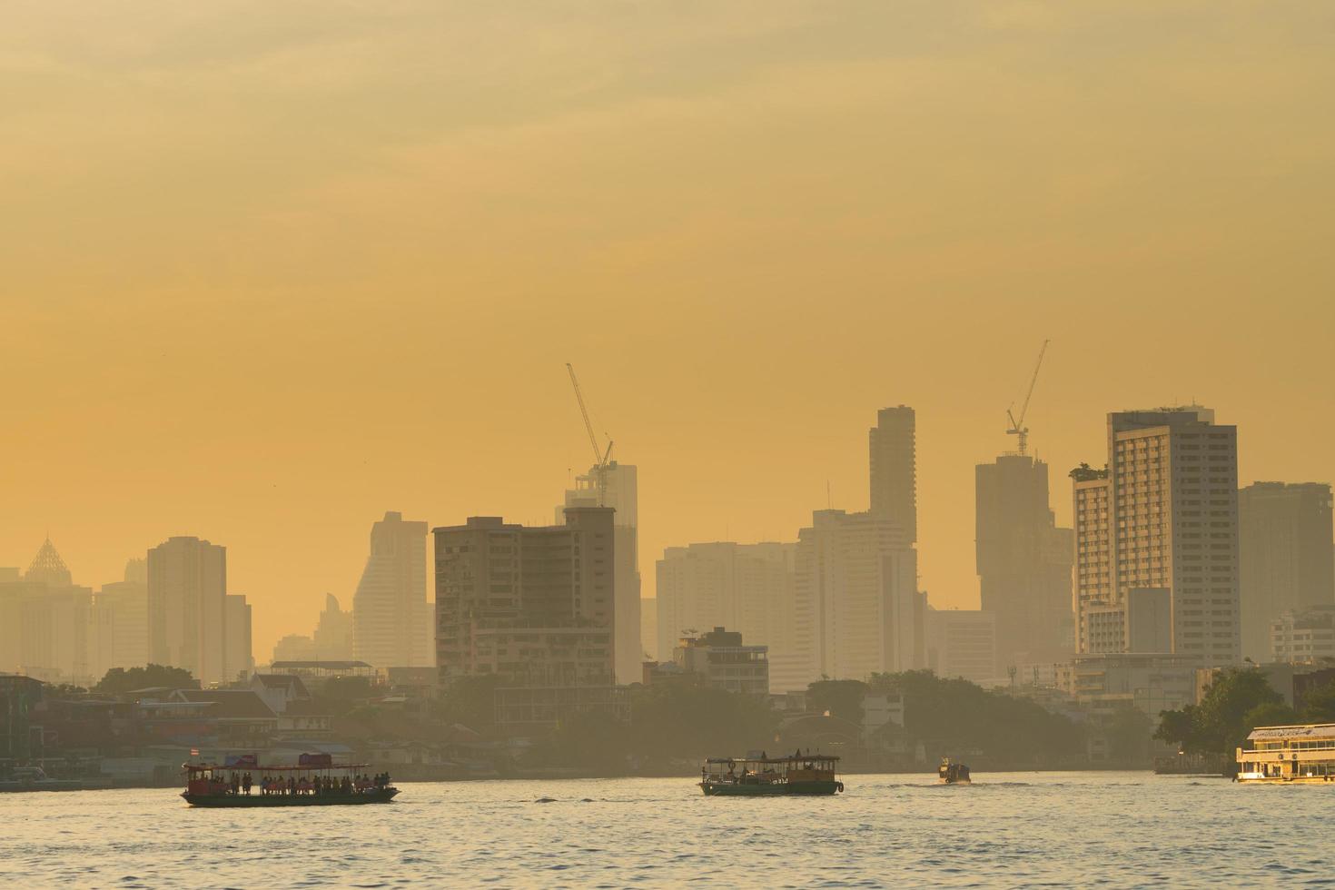 Boat traffic on the river in Bangkok photo