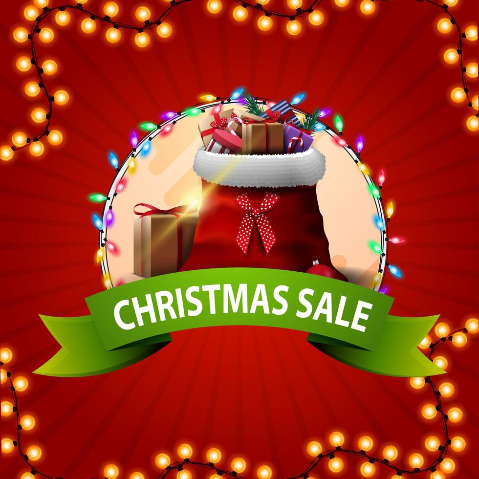 Round Christmas discount banner with green ribbon and Santa Claus bag with gifts. vector