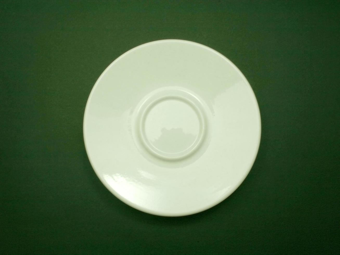 Top view of small white coffee cup saucer photo