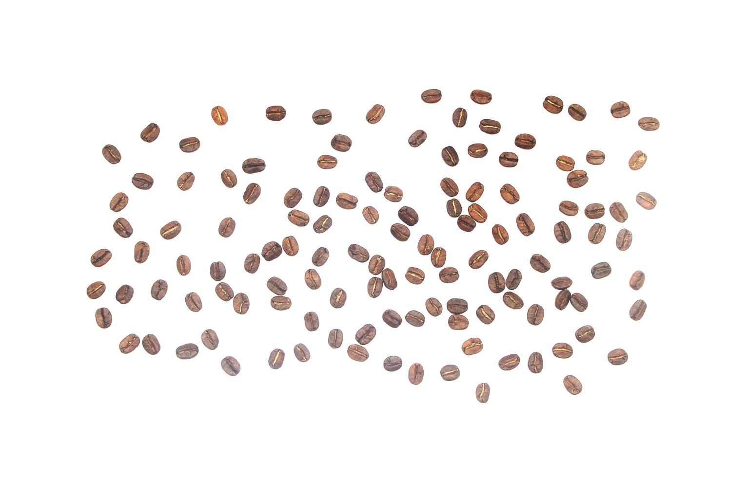 Scattered coffee beans on white photo