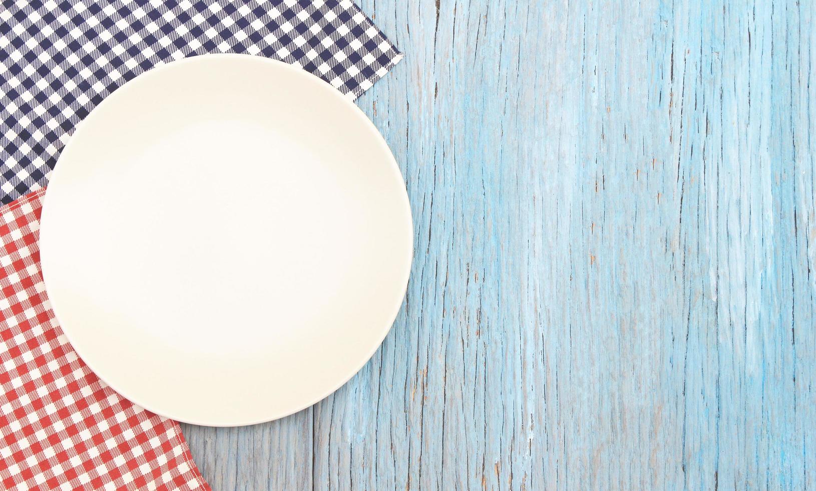 White plate on wood table photo