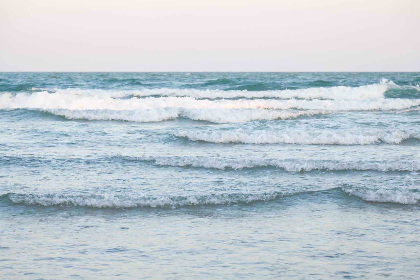 Ocean waves crashing on the beach photo