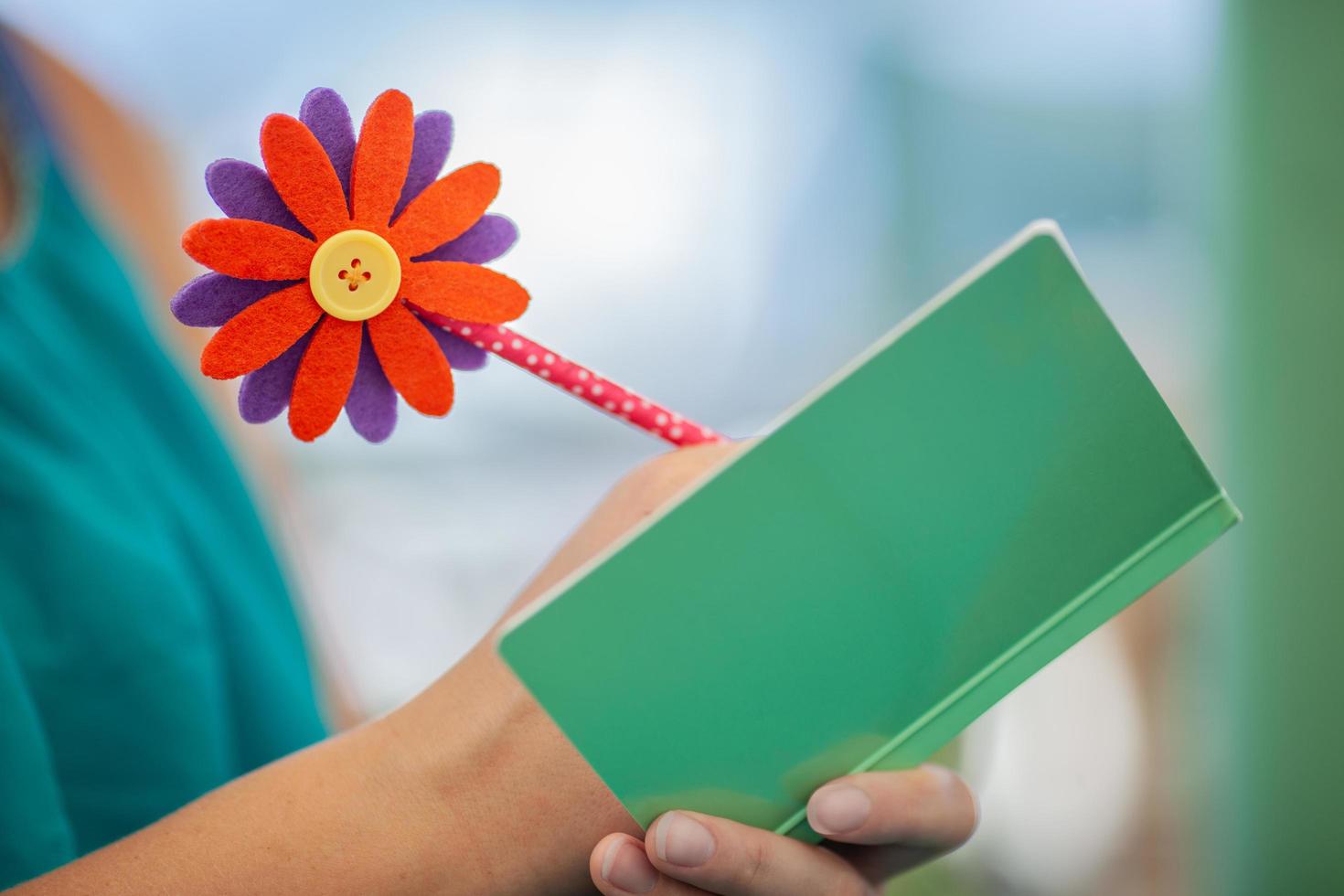 Colorful pen with flower on it photo