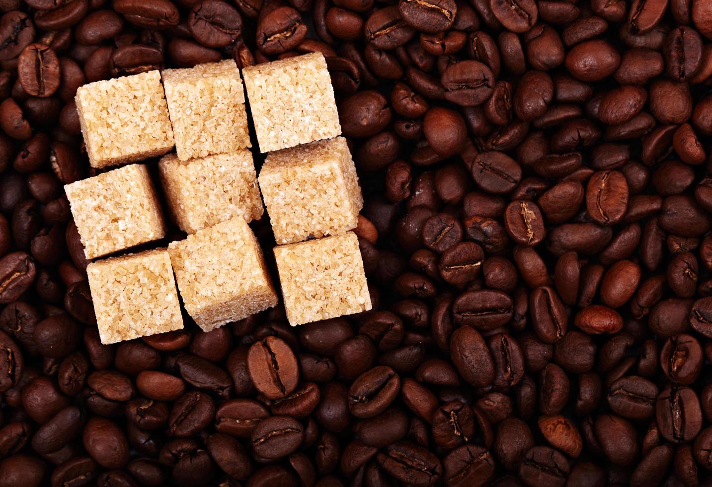 Sugar cubes on coffee photo