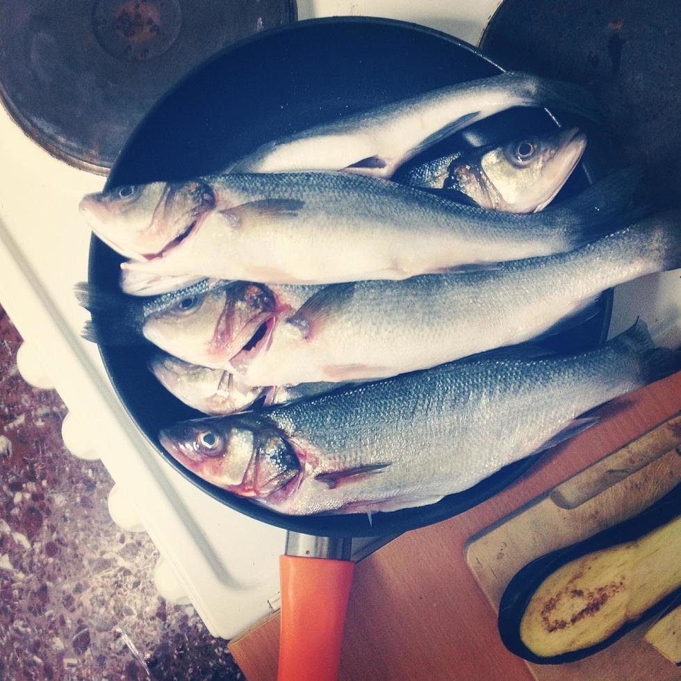 Fish in frying pan photo