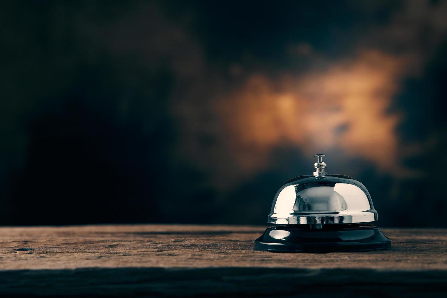 Service bell on dark wooden background photo