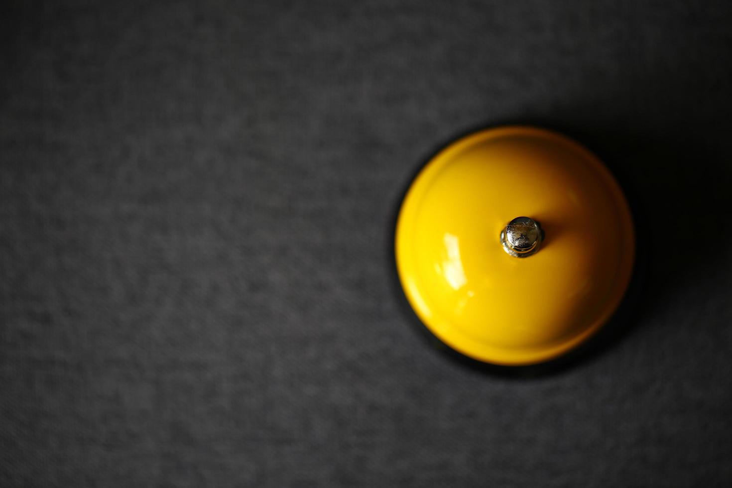 Top view of yellow service bell photo