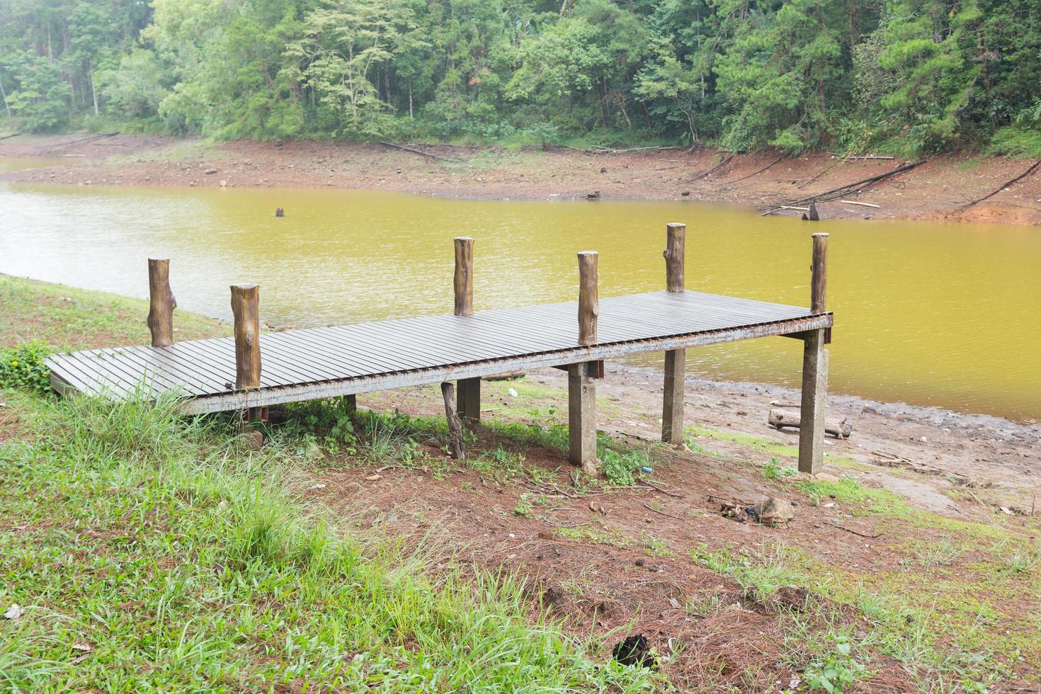 Wooden pier at the river photo