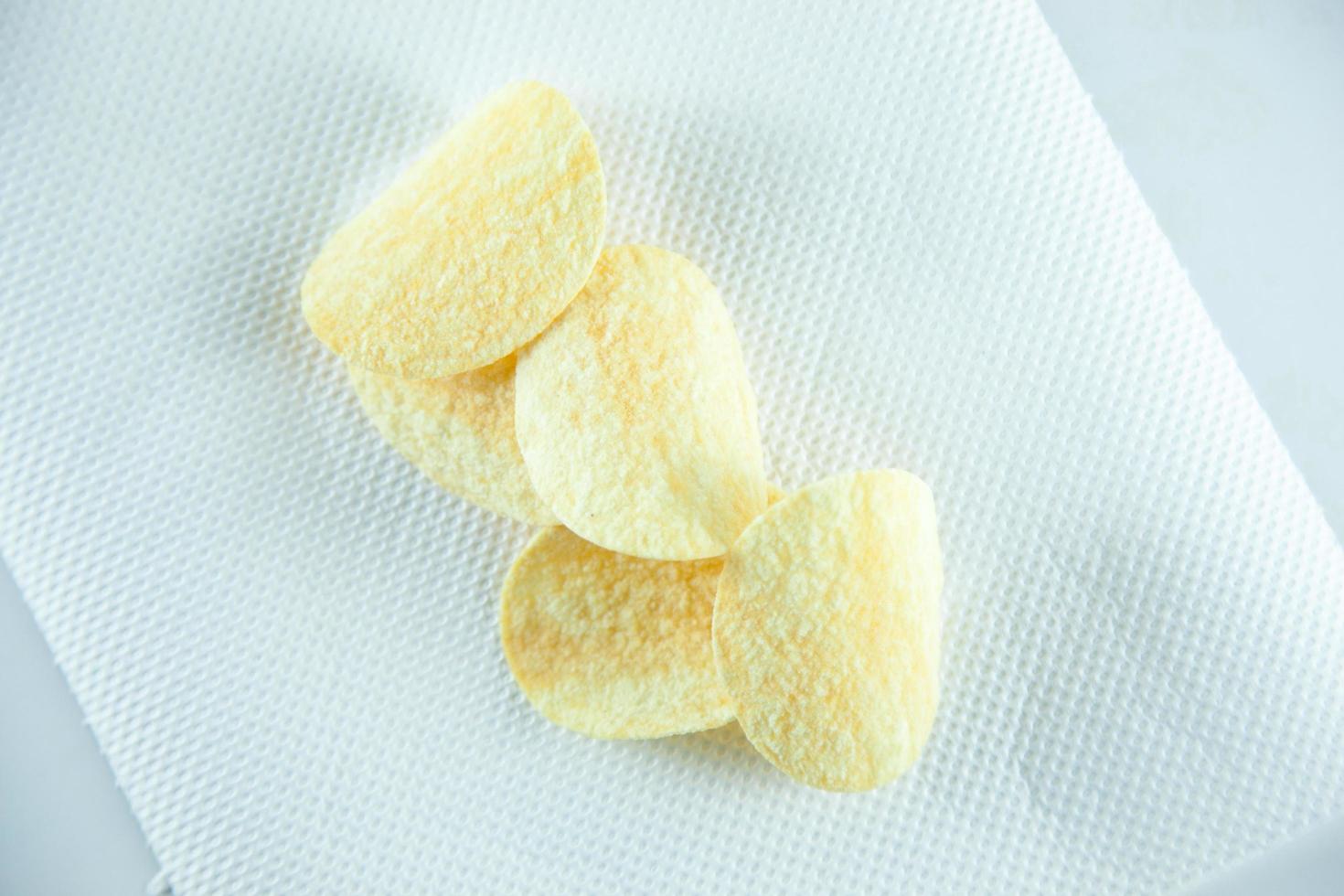 Potato chips on tissue photo