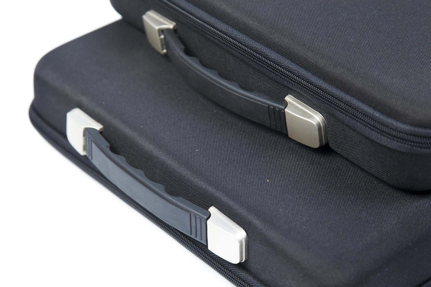 Black briefcases on white background photo