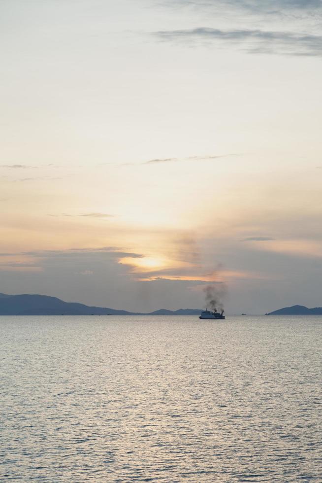 Ship on the sea at sunset photo