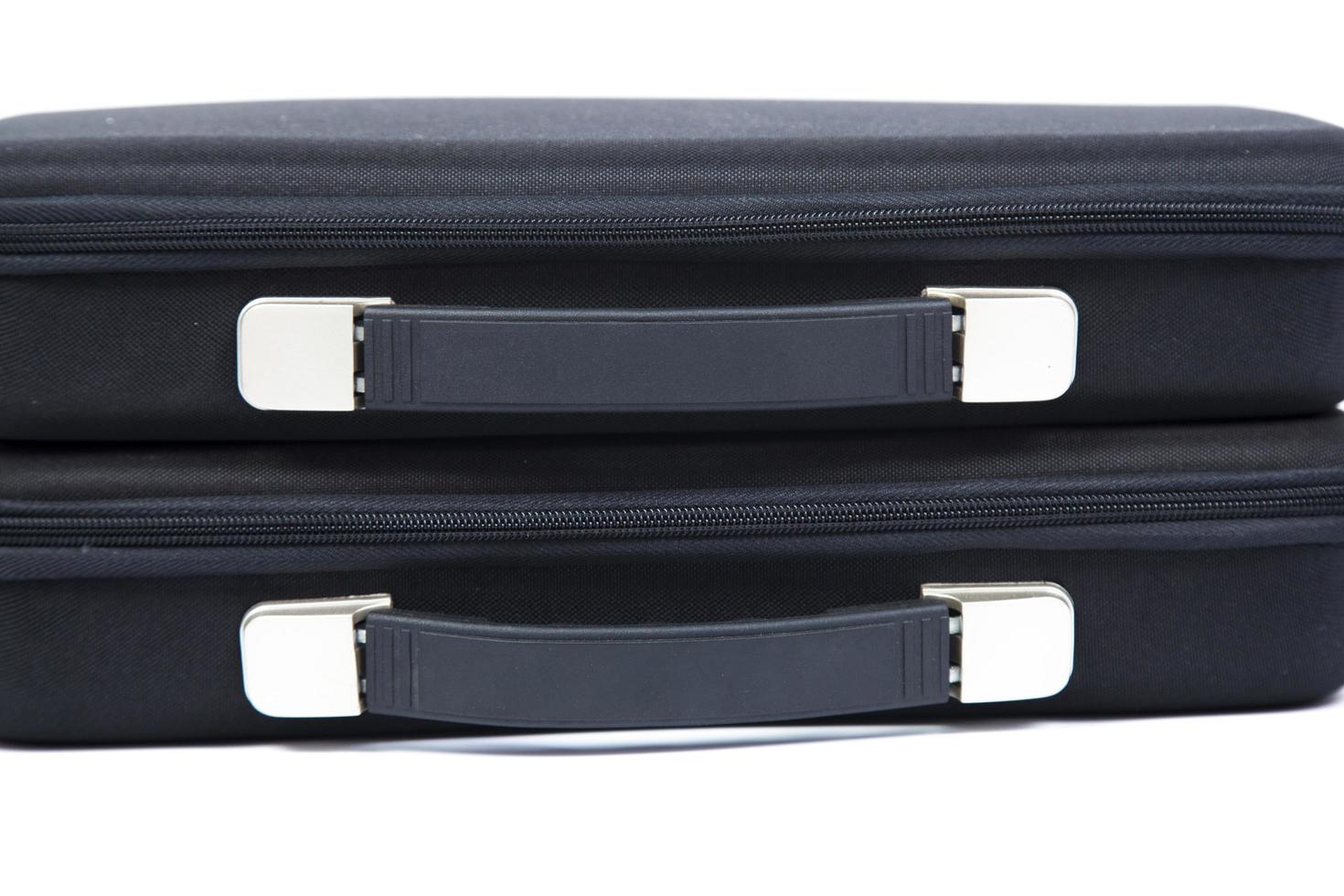 Black briefcases on white background photo