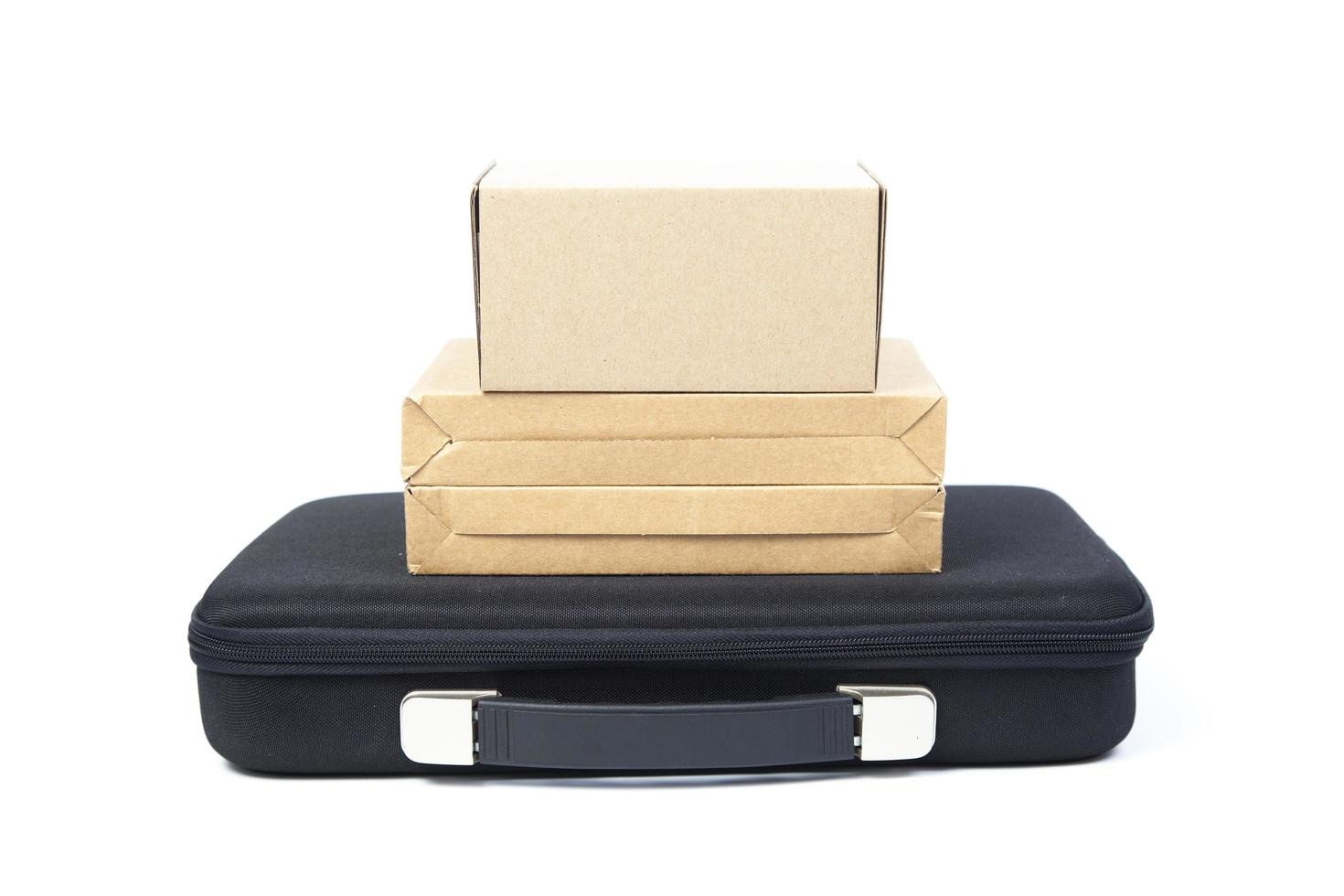 Brown paper boxes on a black briefcase photo