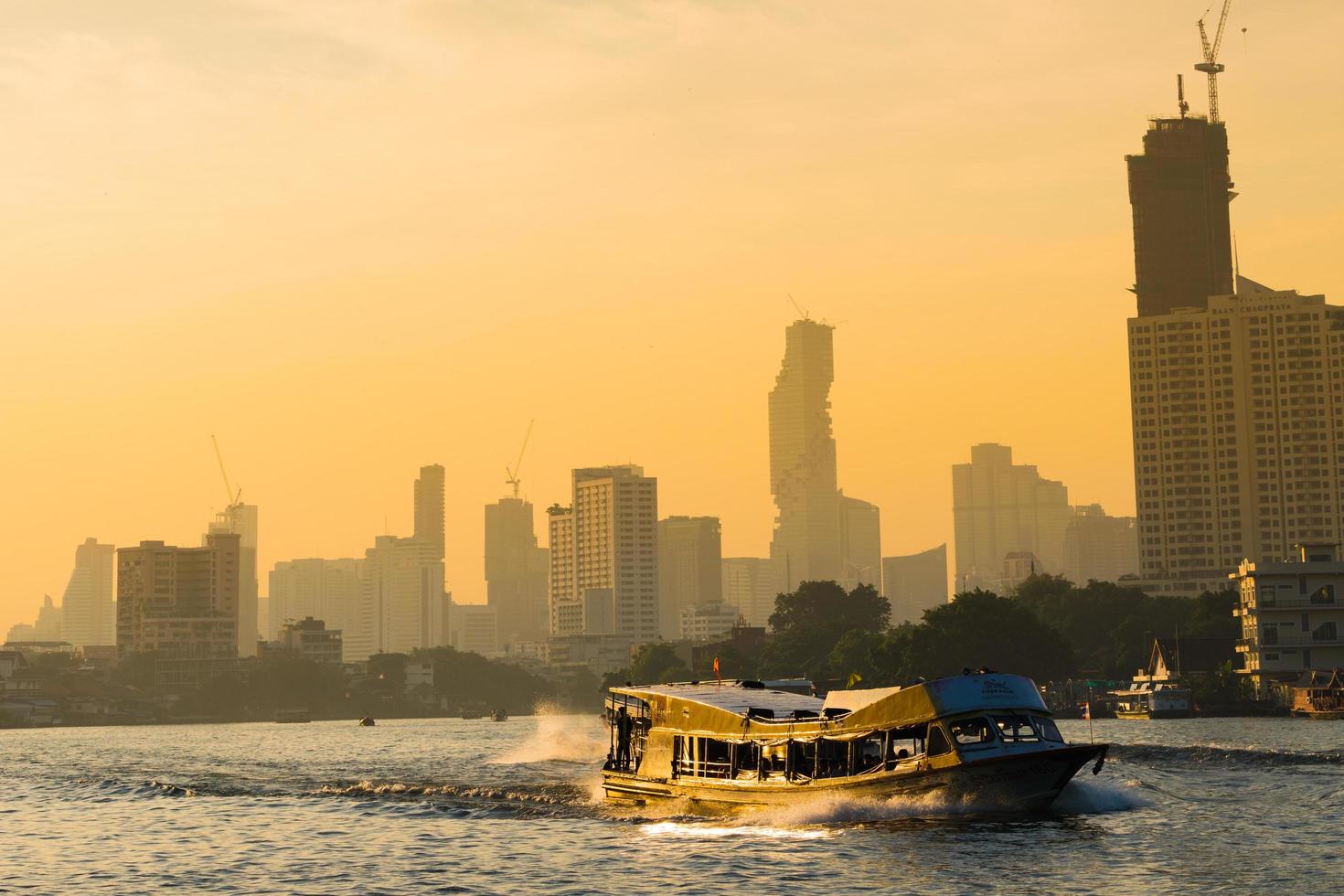 Boat traffic on the river in Bangkok photo