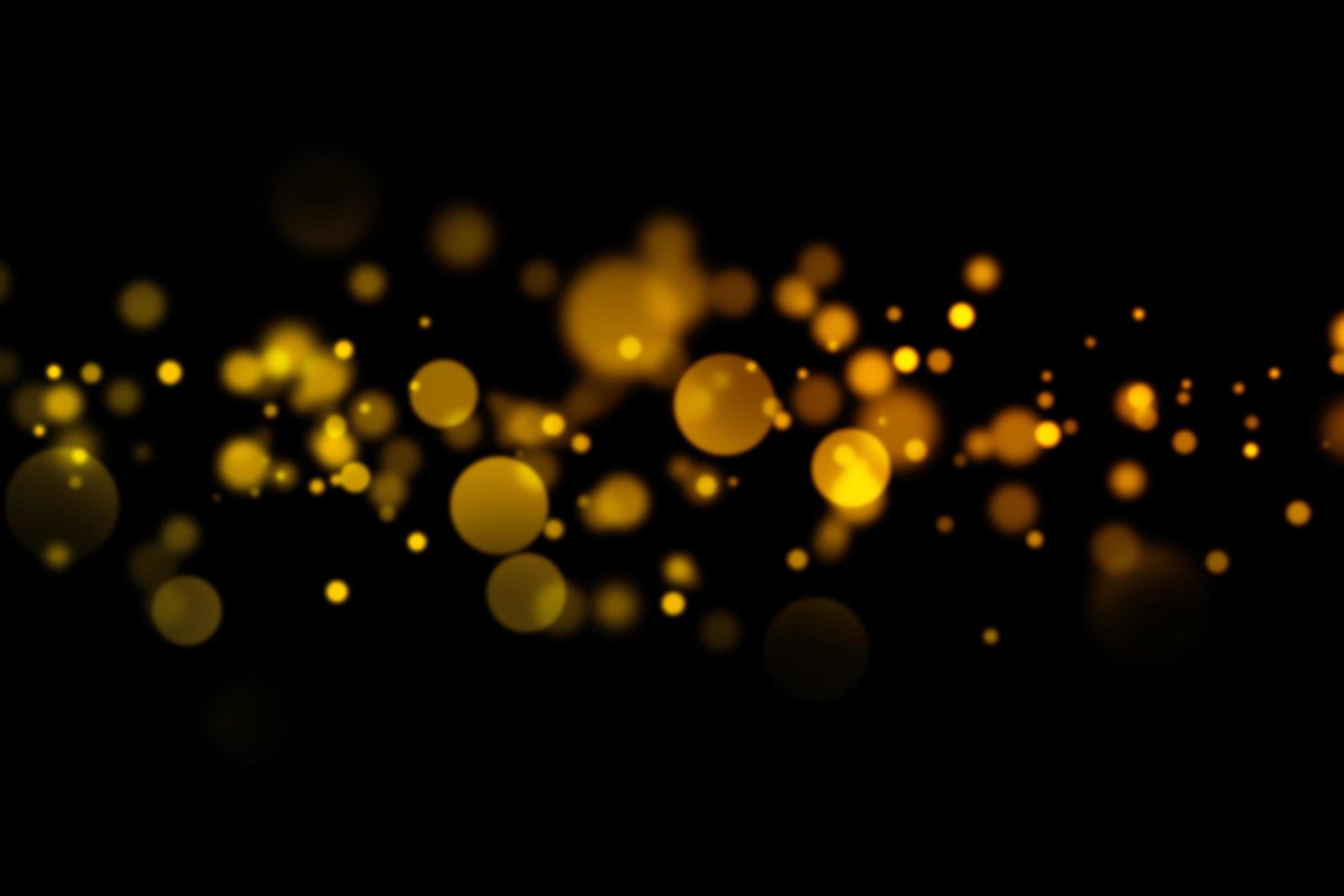 Blurred gold circles on black background photo