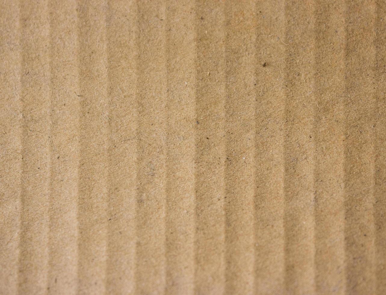 Close-up de papel marrón estriado para textura o fondo foto