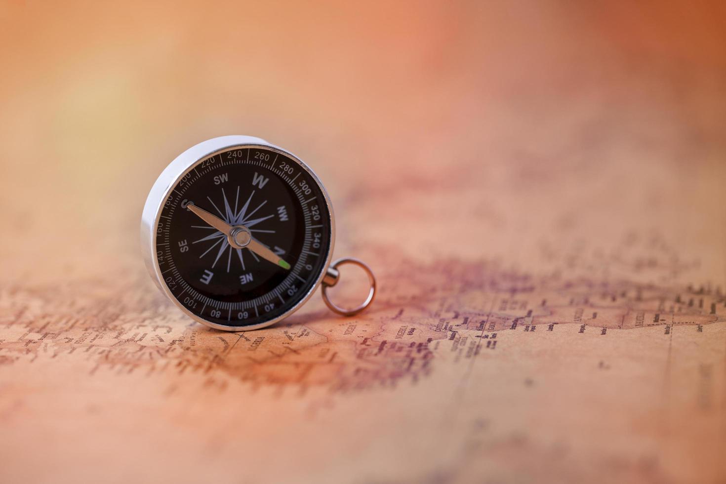 Compass on a vintage map photo