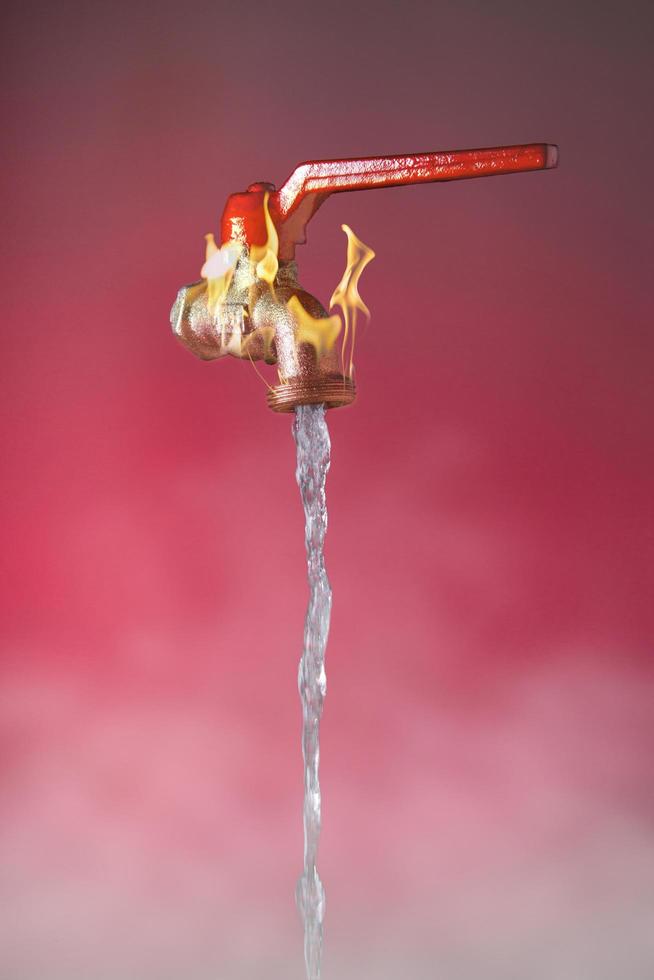 Water flowing from faucet with flames and red lever on red background photo