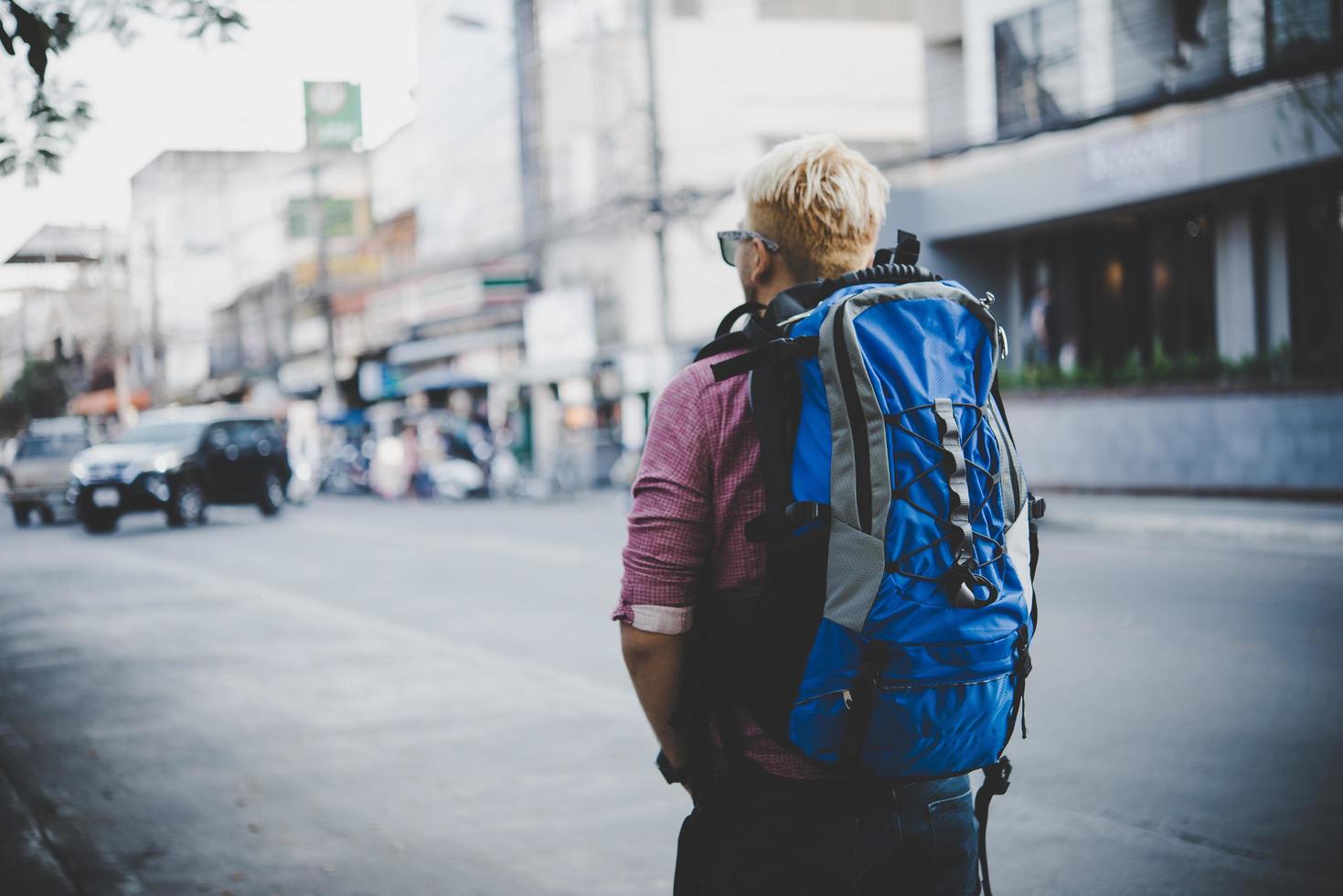 Young hipster traveling backpacker around Asia photo