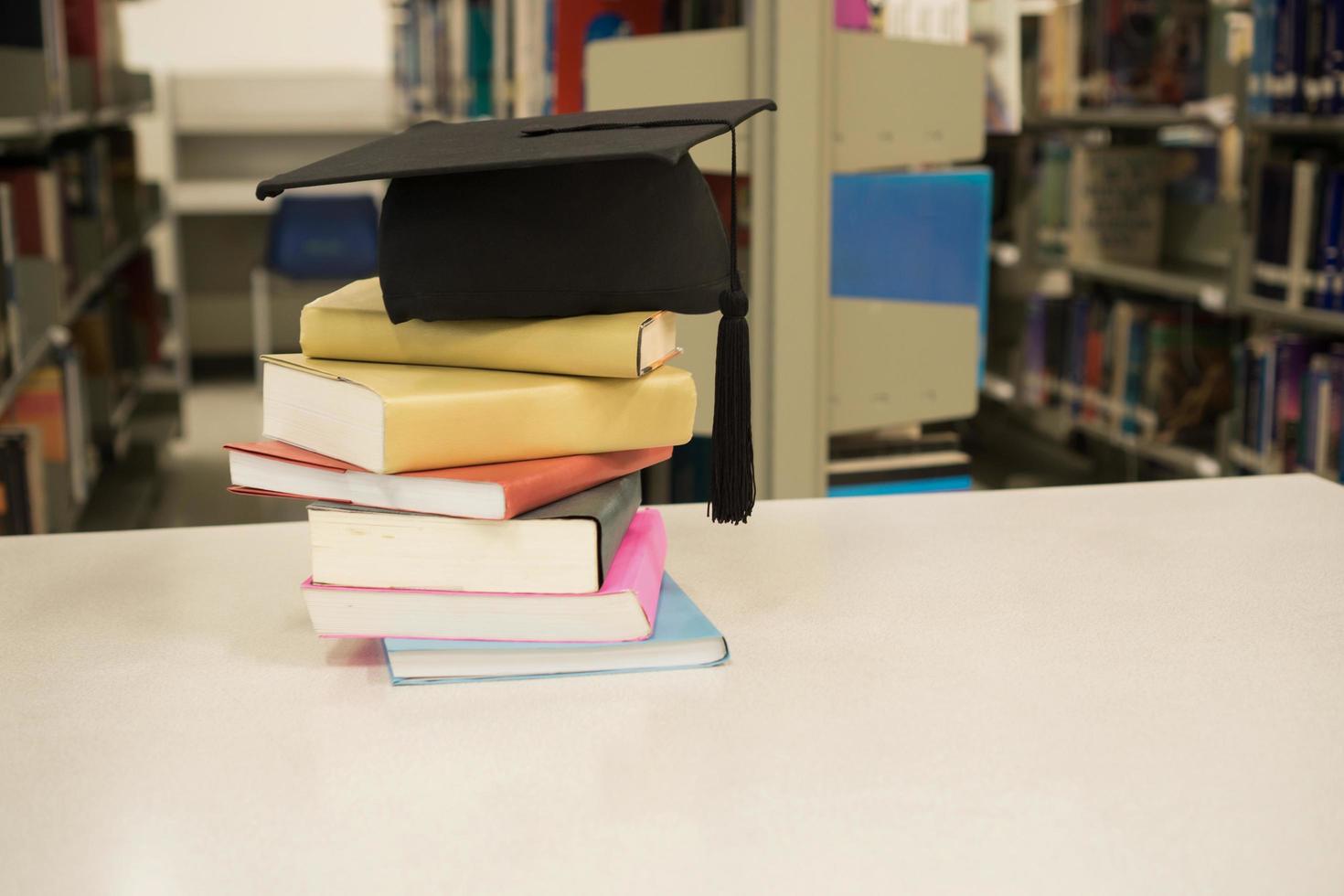 A mortarboard stacked on books photo