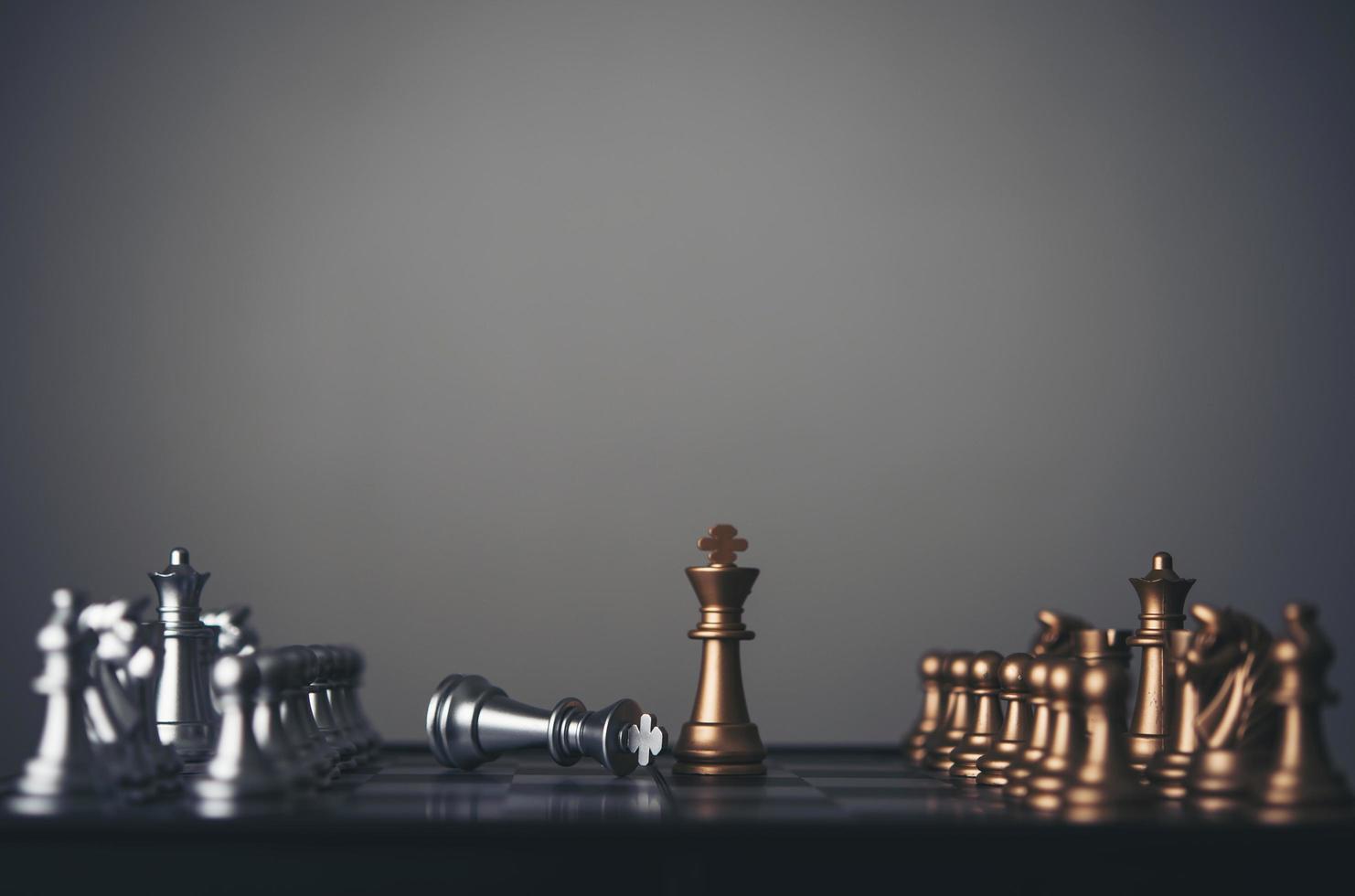 King and knight chess setup on dark background photo