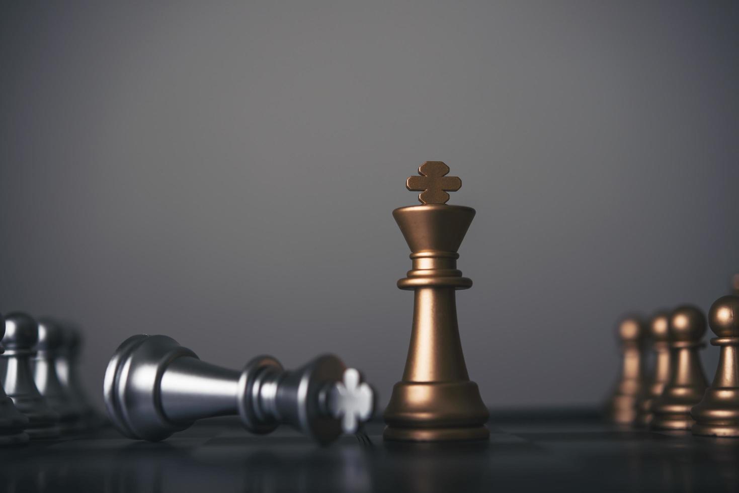 King and knight chess setup on dark background photo