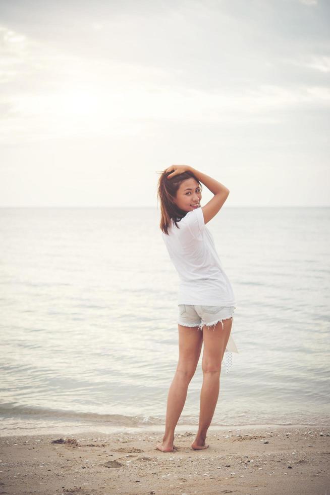 Young beautiful woman at the beach photo