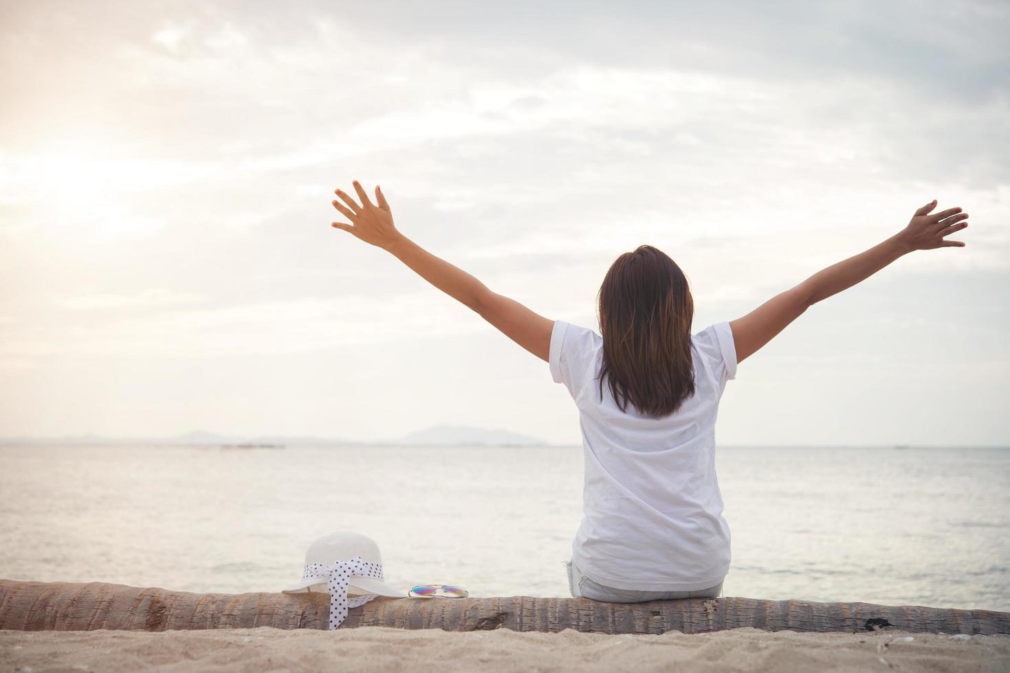 Young beautiful woman relaxing at the beach photo