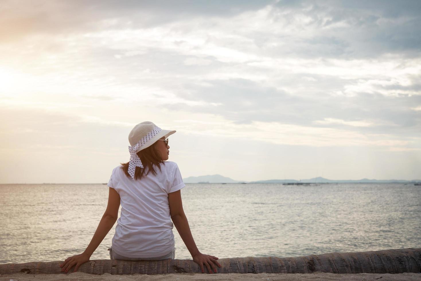 Young beautiful woman relaxing at the beach photo