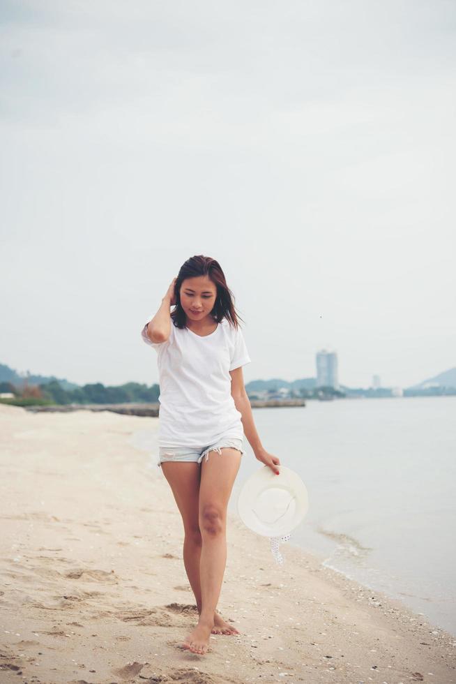 Young beautiful woman at the beach photo