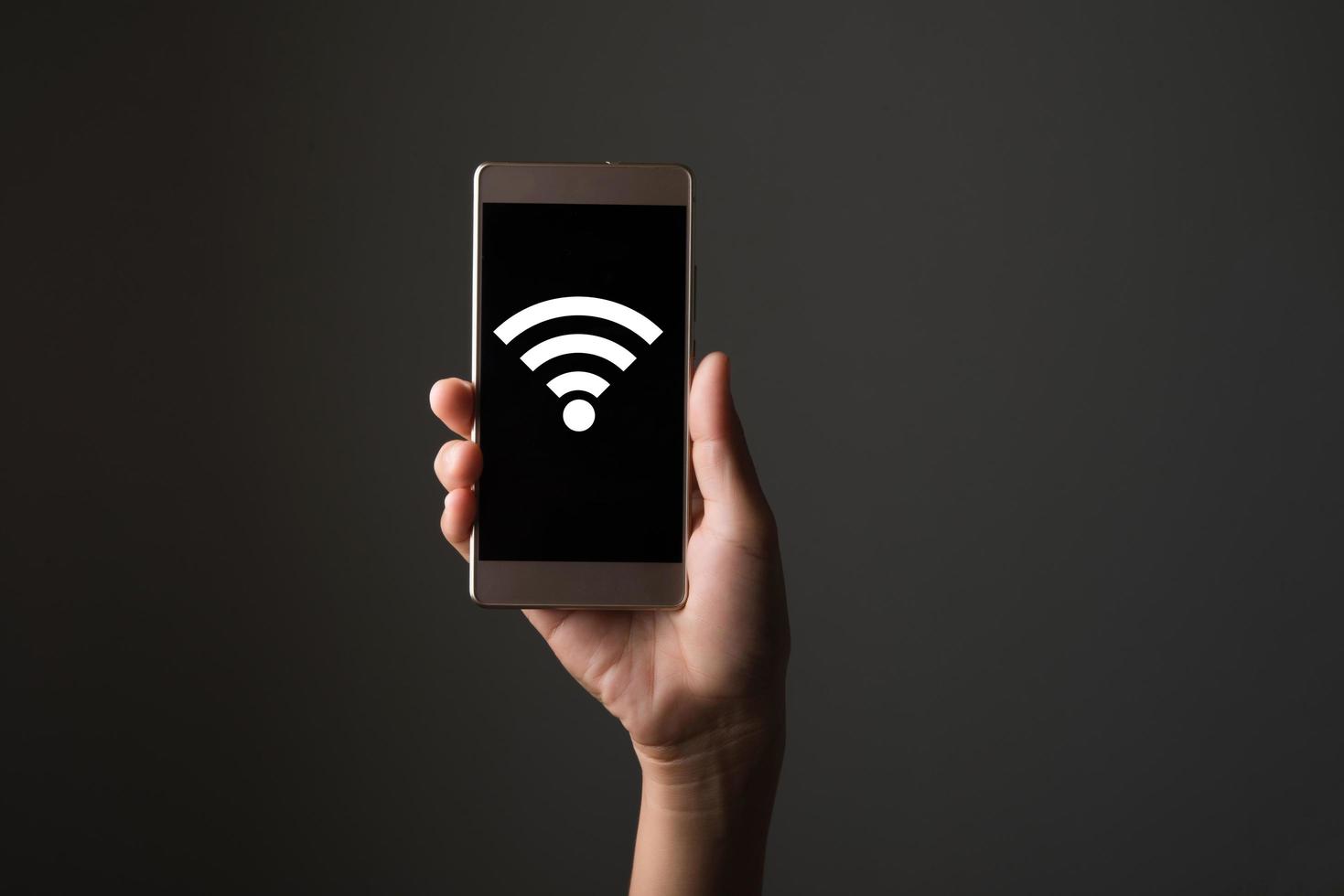 Wifi icon on smart phone screen photo
