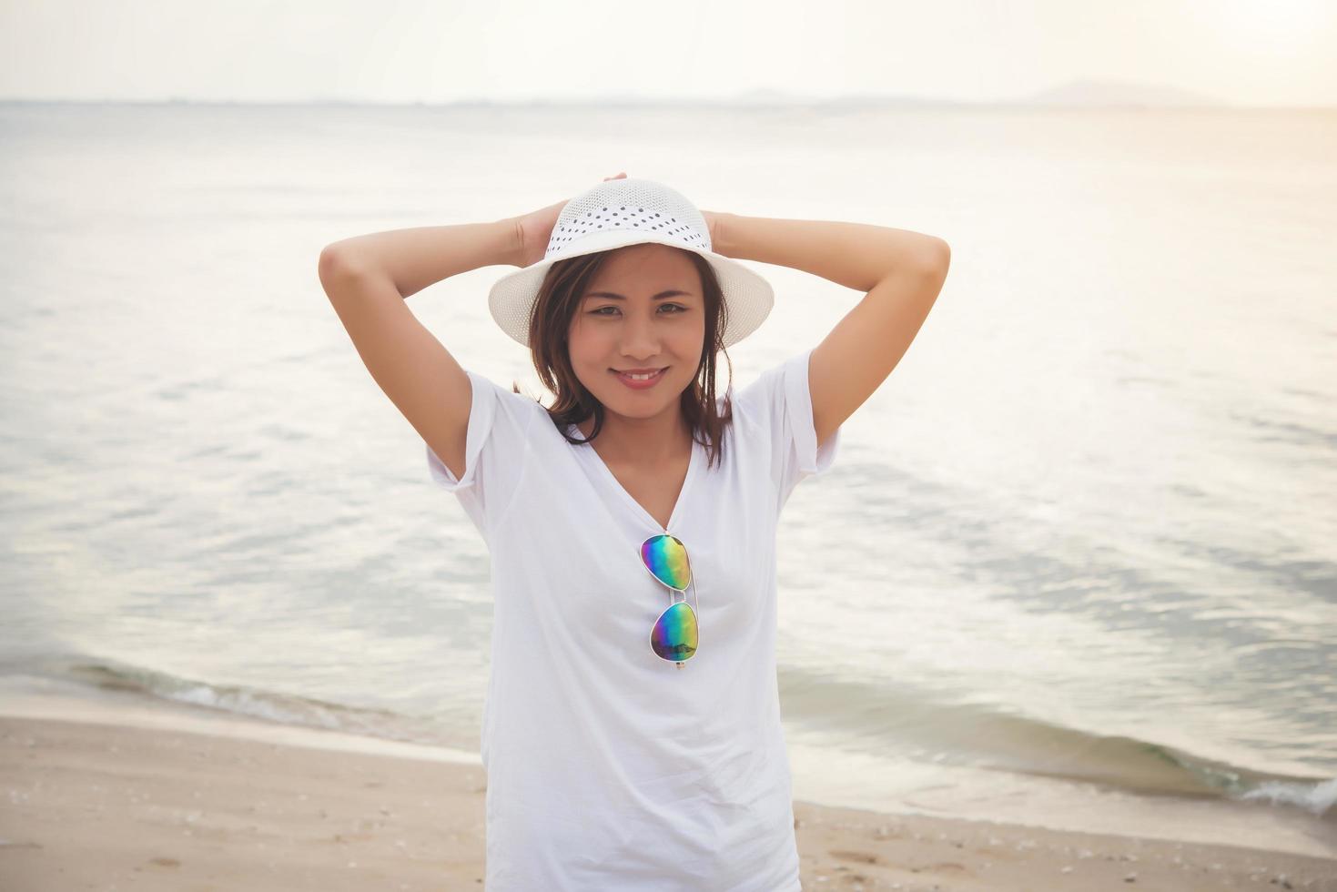 Young beautiful woman at the beach photo