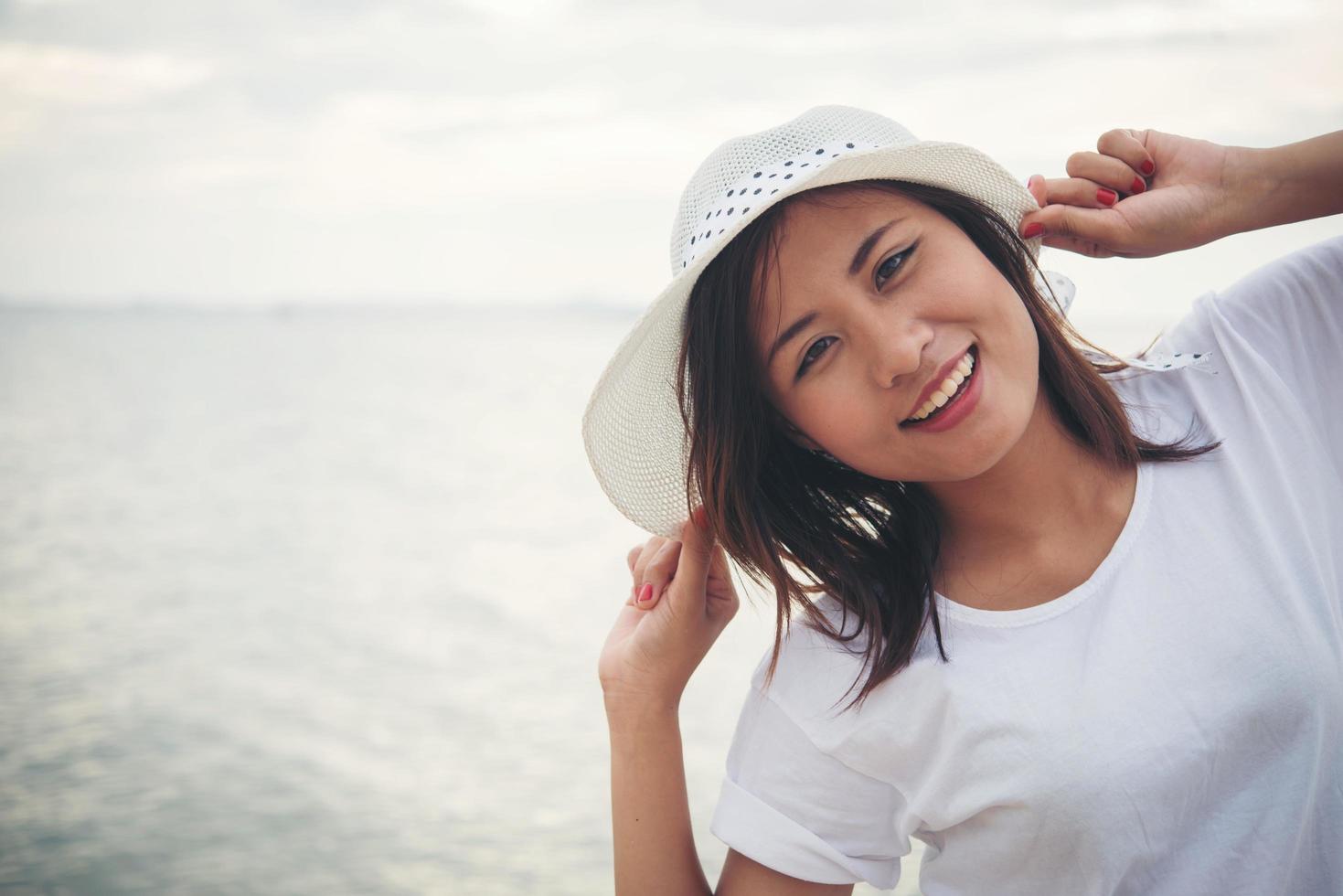 Young beautiful woman relaxing at the beach photo