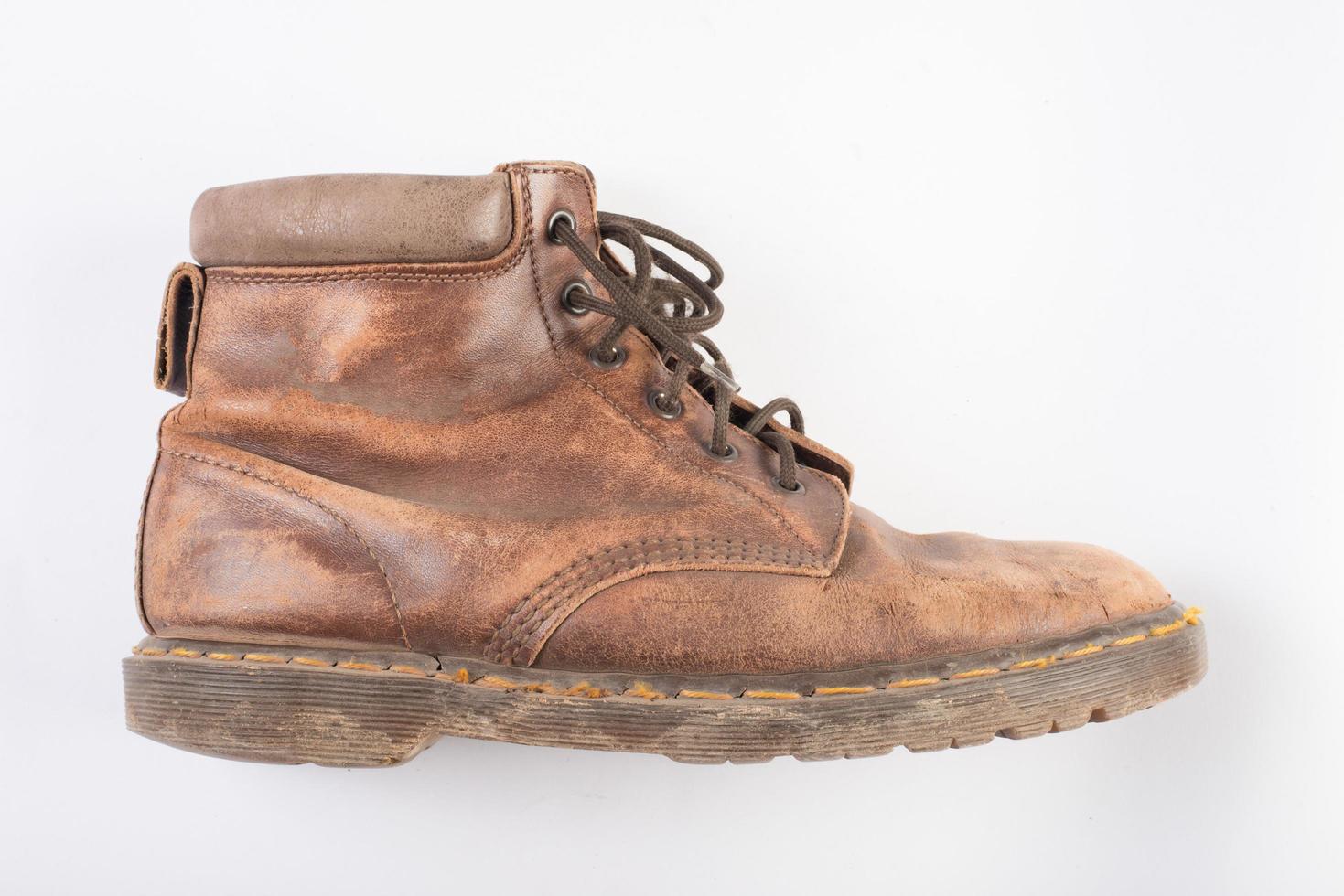 Pair of old brown boots Isolated on a white background photo