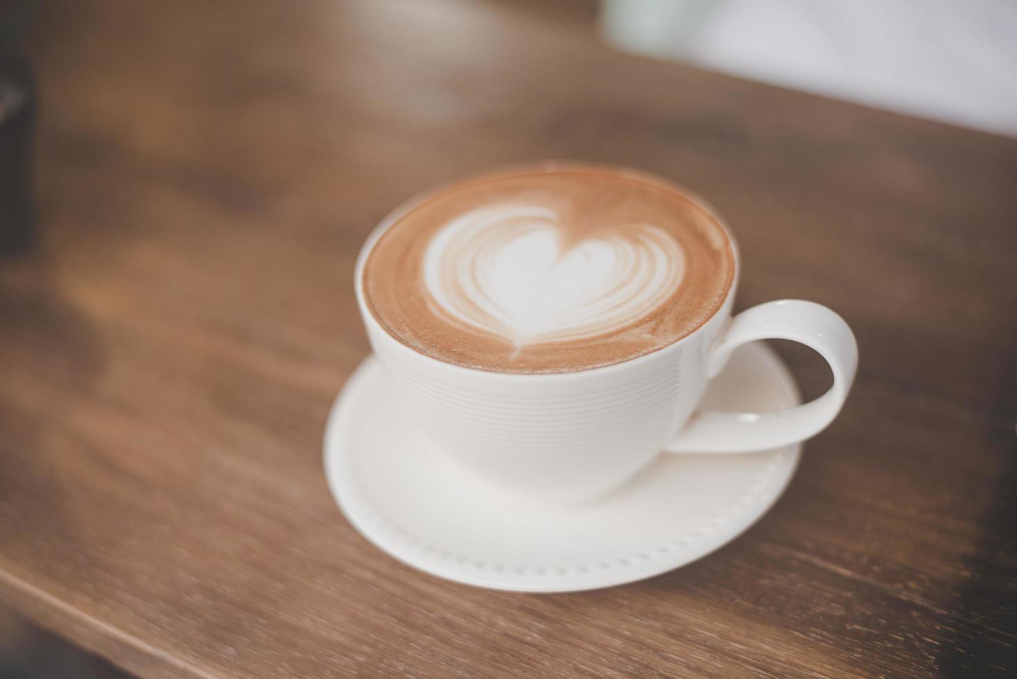 Hot art latte coffee with heart shape photo