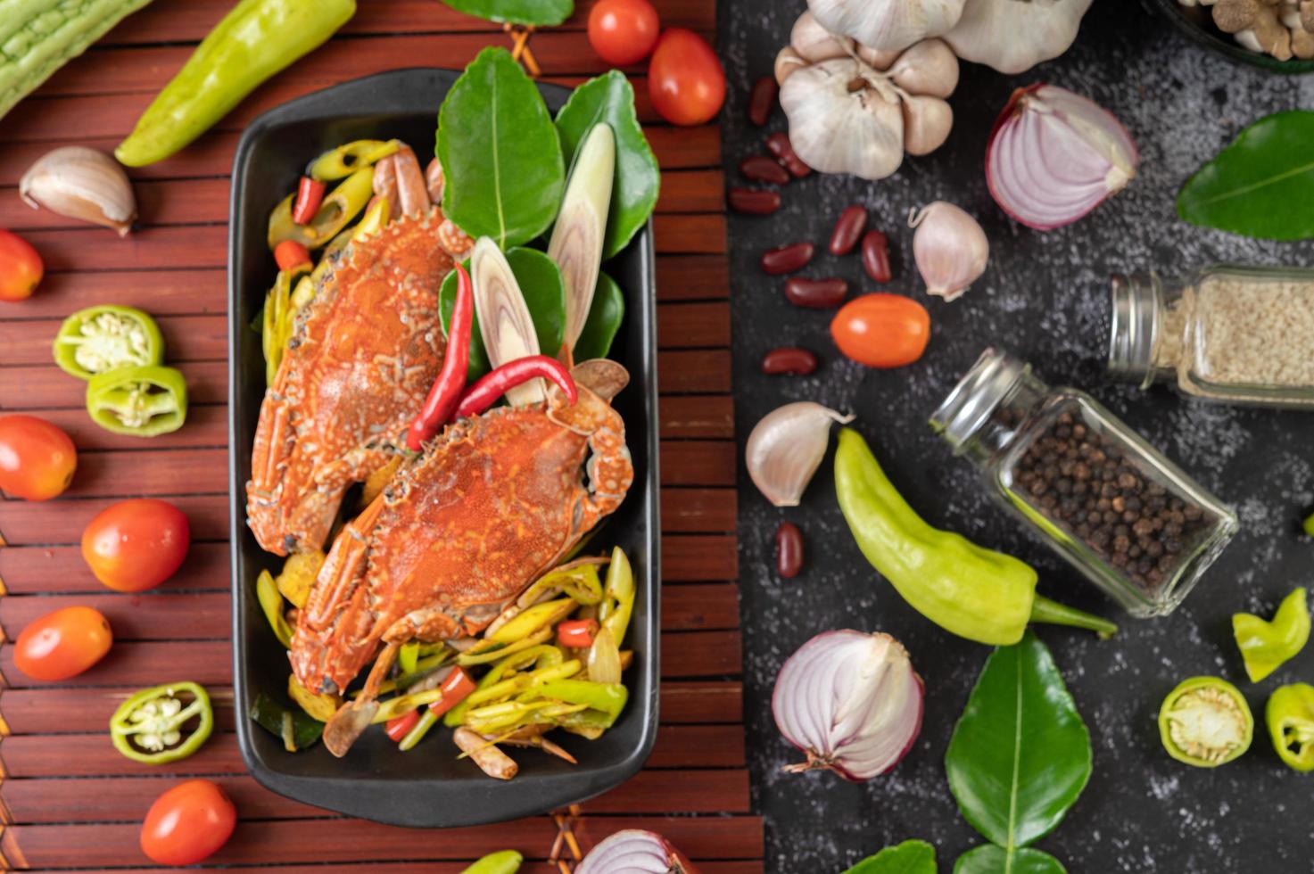 Stir-fried crab with curry powder on a wood plate photo