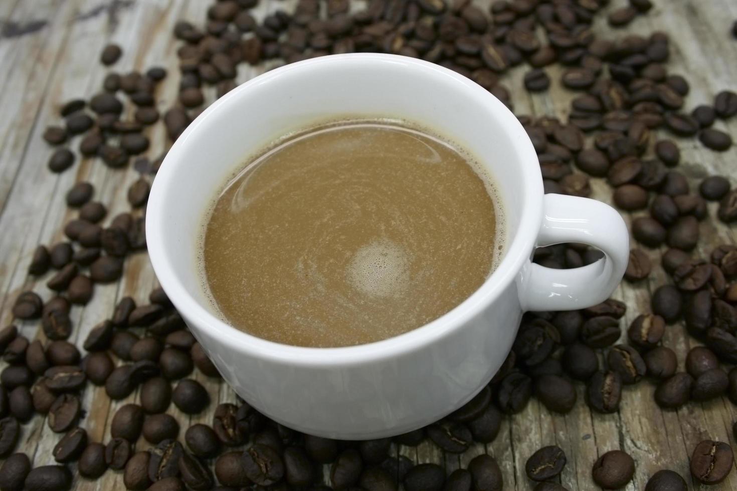 View of cup of coffee and coffee beans photo