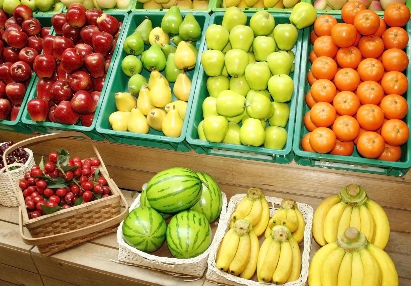 Colorful fruit in stands photo